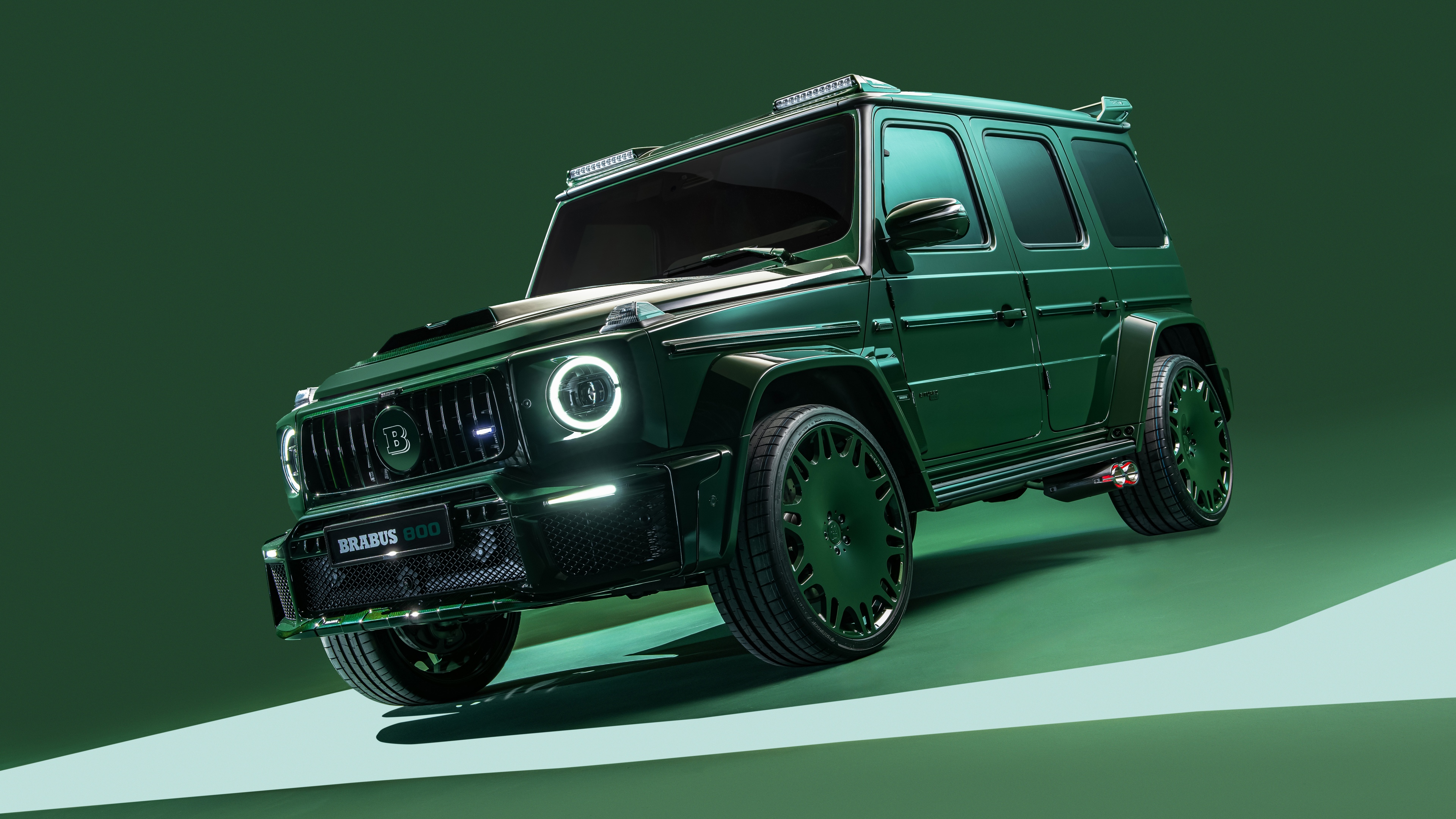 A high-detail shot of a Mercedes-AMG G 63 G-Wagon featuring a vibrant green aesthetic.
