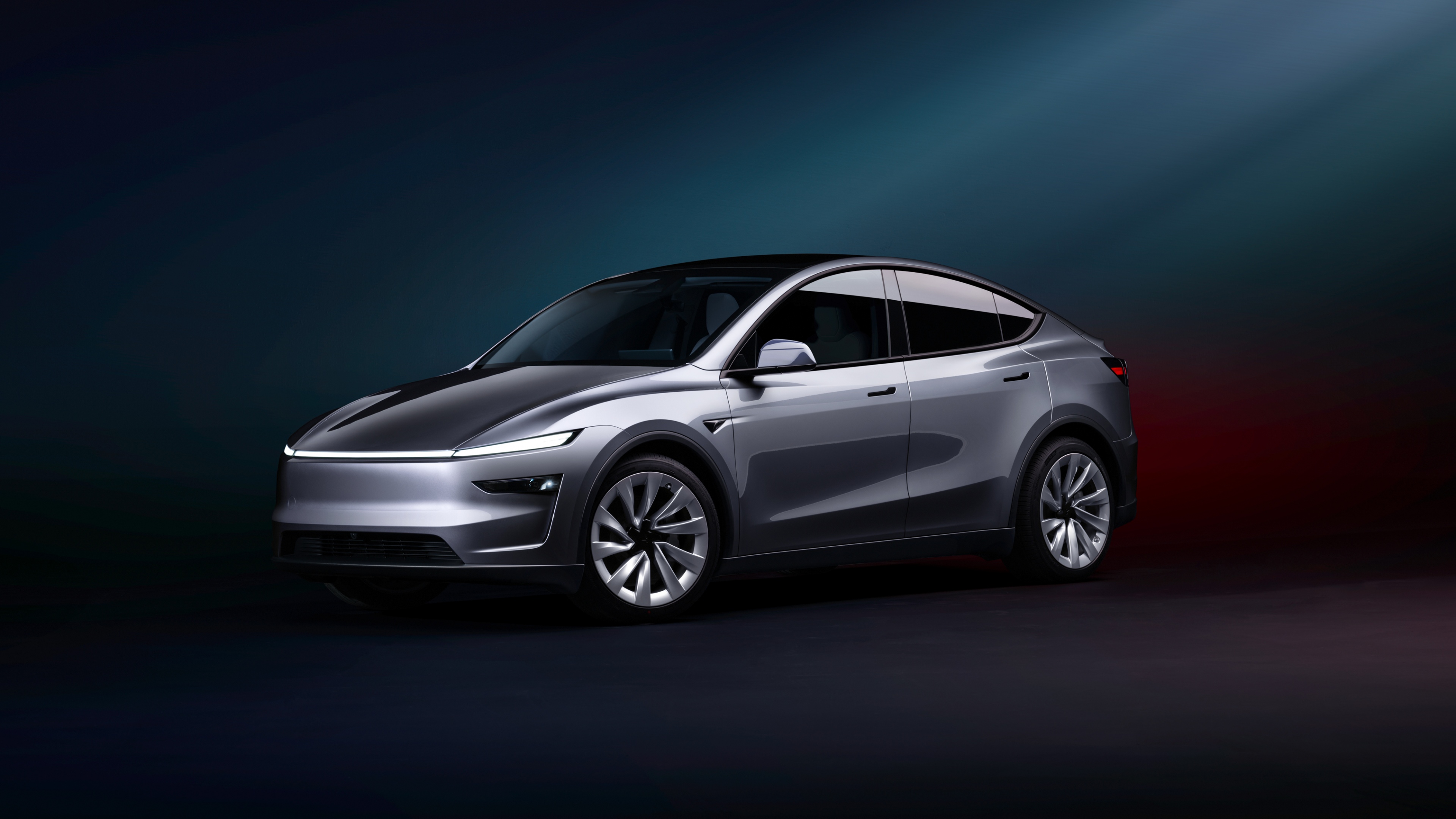 A modern electric car with glowing blue accents parked on a futuristic city street.