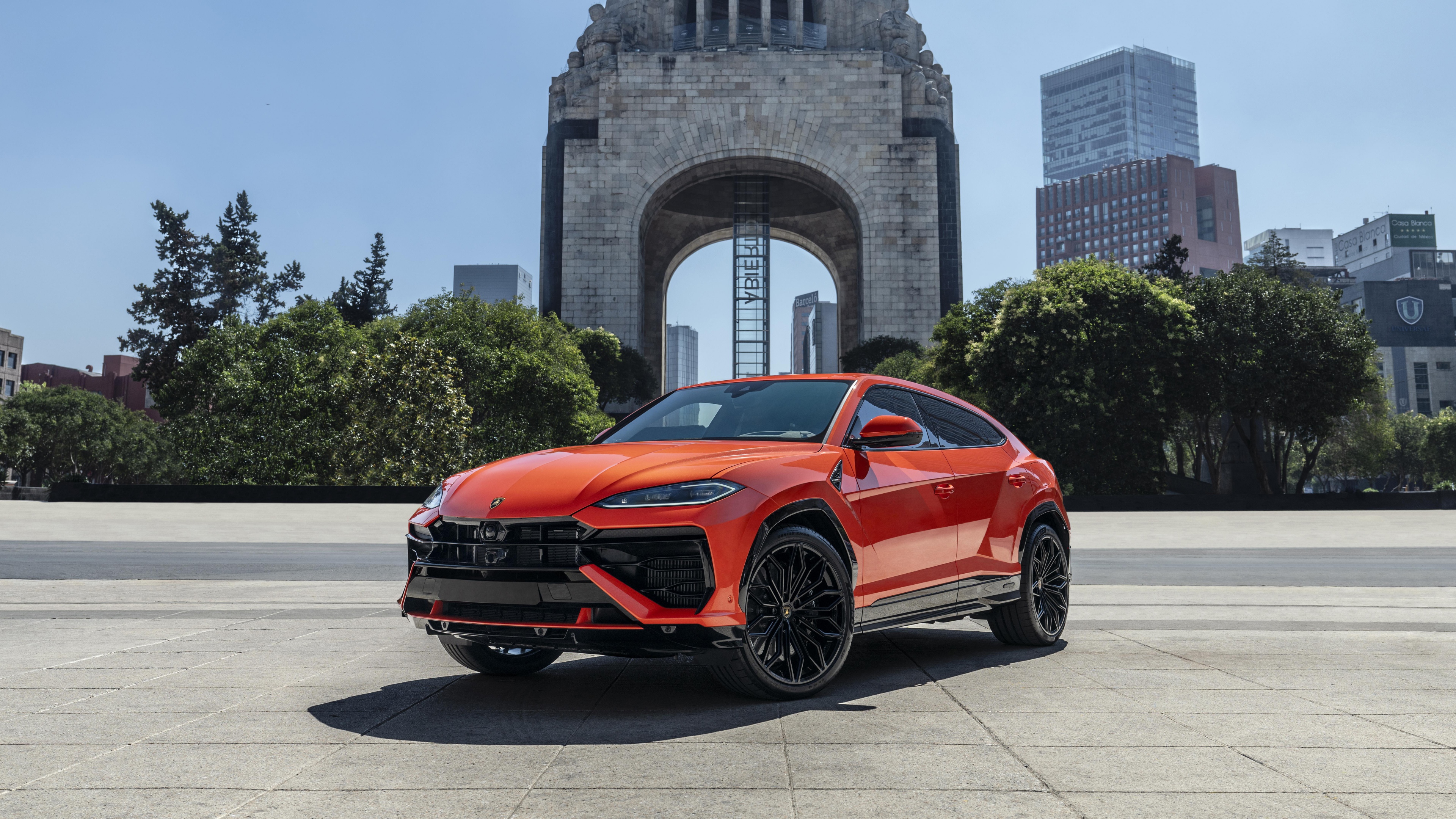 A luxury Lamborghini Urus SE plug-in hybrid SUV parked in a beautiful Mexican landscape.