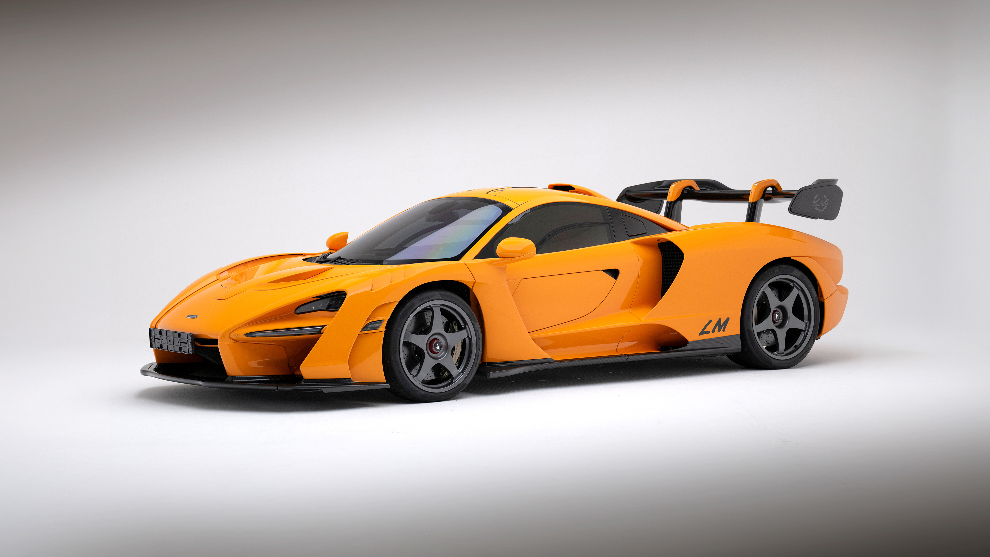 A high-quality CGI visualization of a McLaren Senna LM sports car featuring aerodynamic precision.