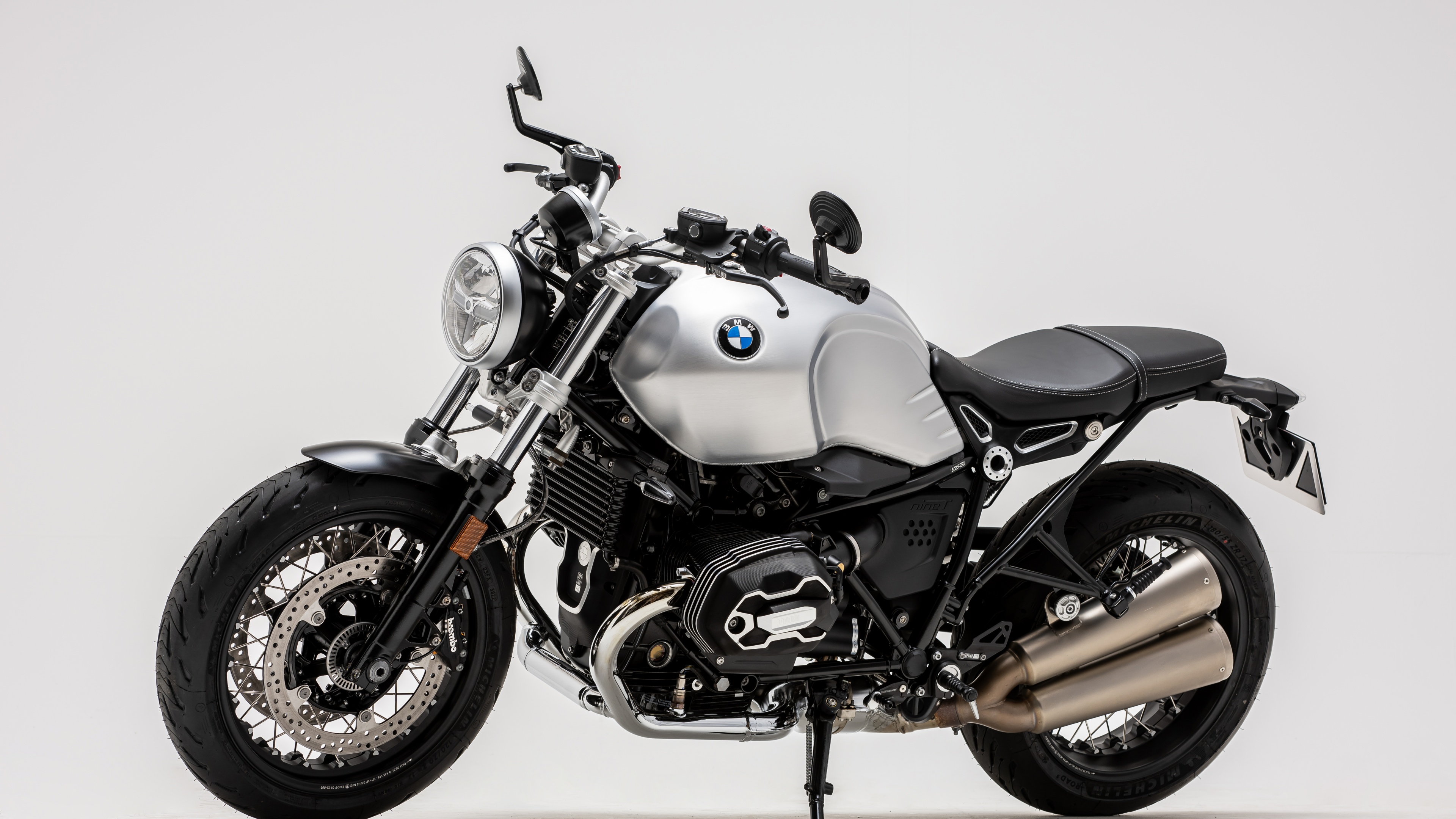 A detailed shot of the 2023 BMW R nineT Final Edition motorcycle in white.