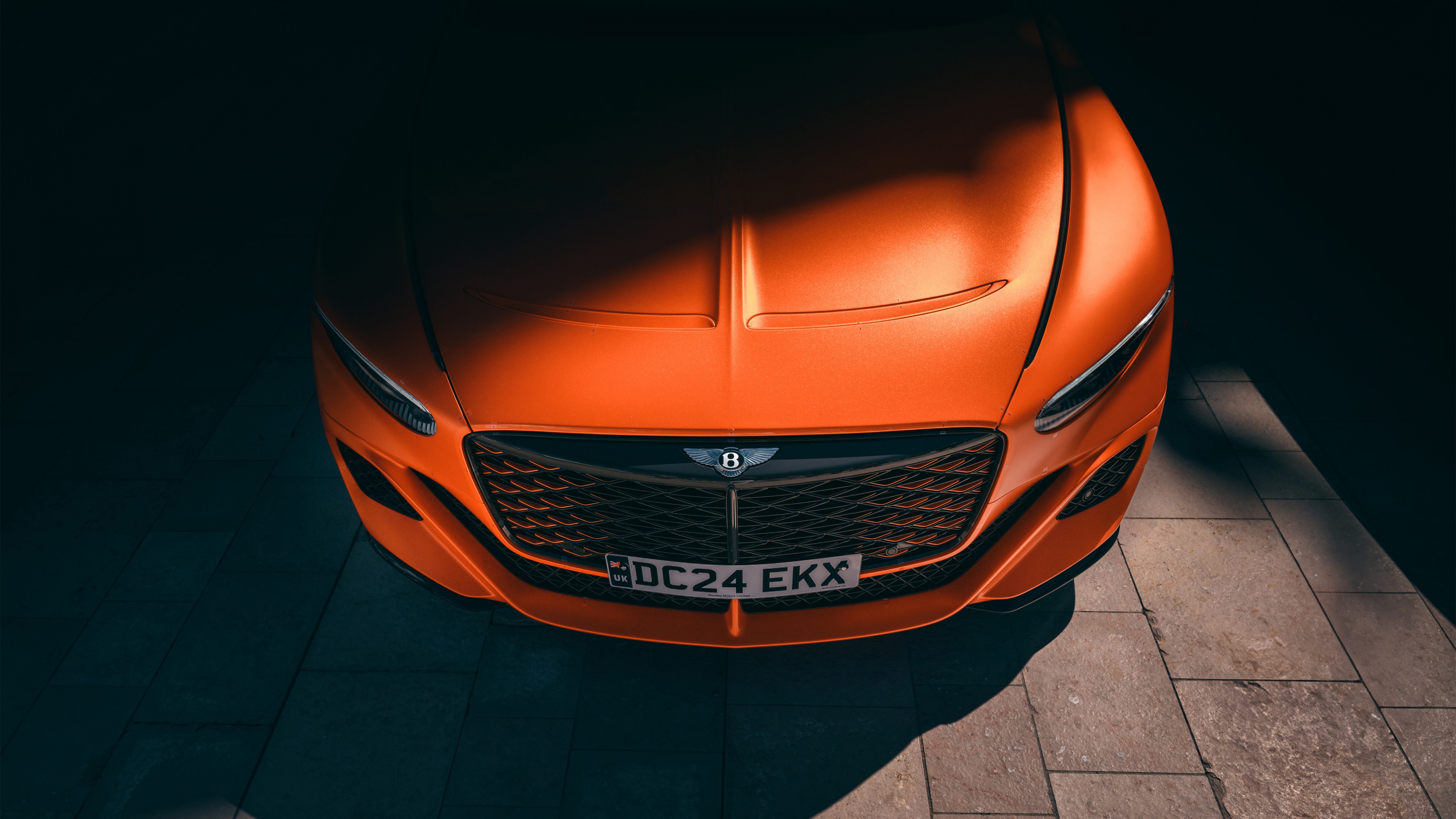 A high-resolution, cinematic view of the 2024 Bentley Mulliner Batur Convertible luxury car.