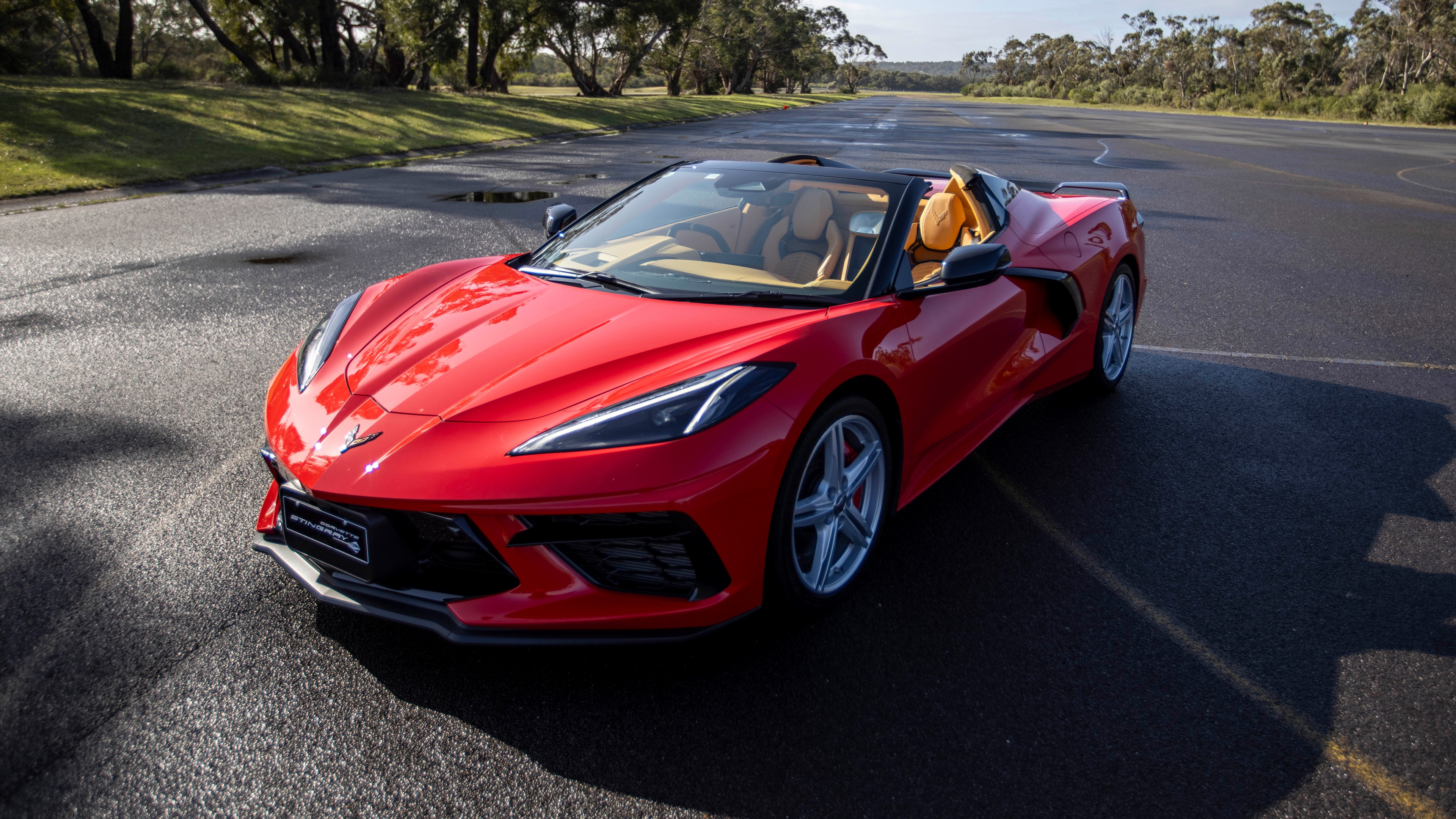 A detailed view of a 2024 Chevrolet Corvette Stingray Convertible, highlighting its aerodynamic sports car design and polished exterior.
