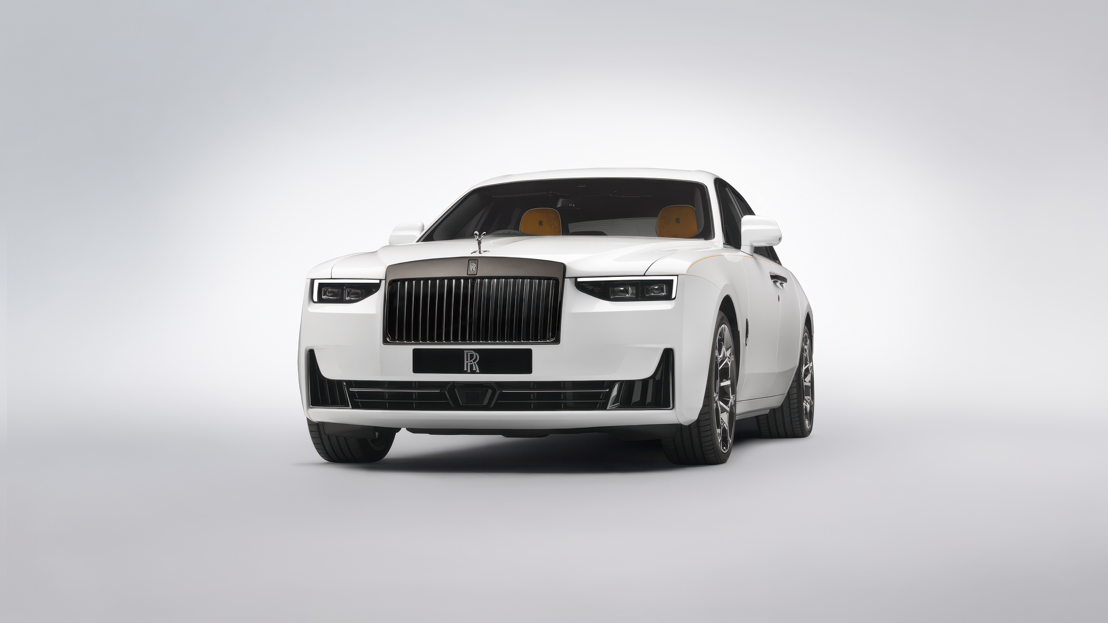 A luxury 2024 Rolls-Royce Black Badge Ghost Series II presented in a minimalist white aesthetic on a solid white background.