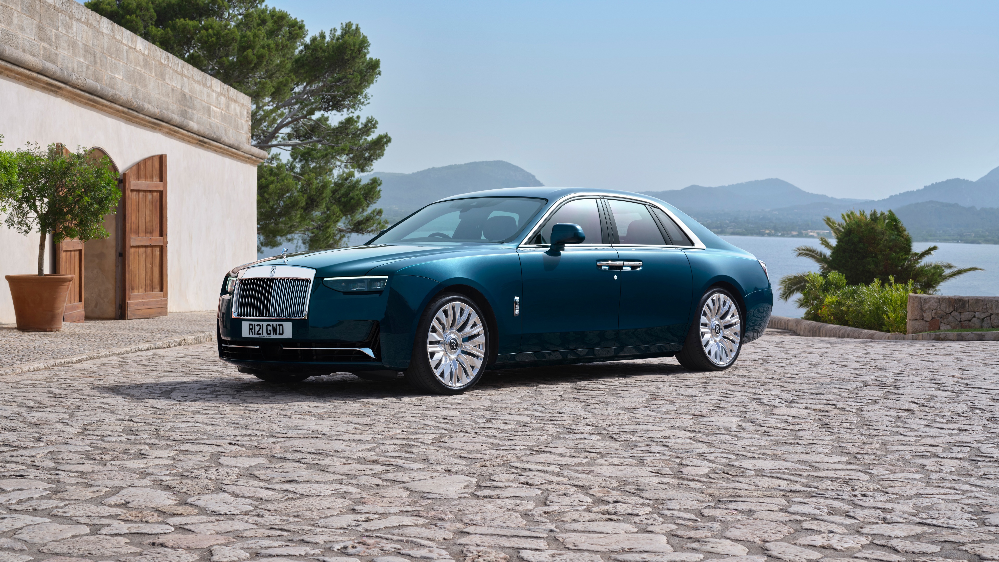 A high-resolution, cinematic shot of the 2024 Rolls-Royce Ghost luxury automobile.