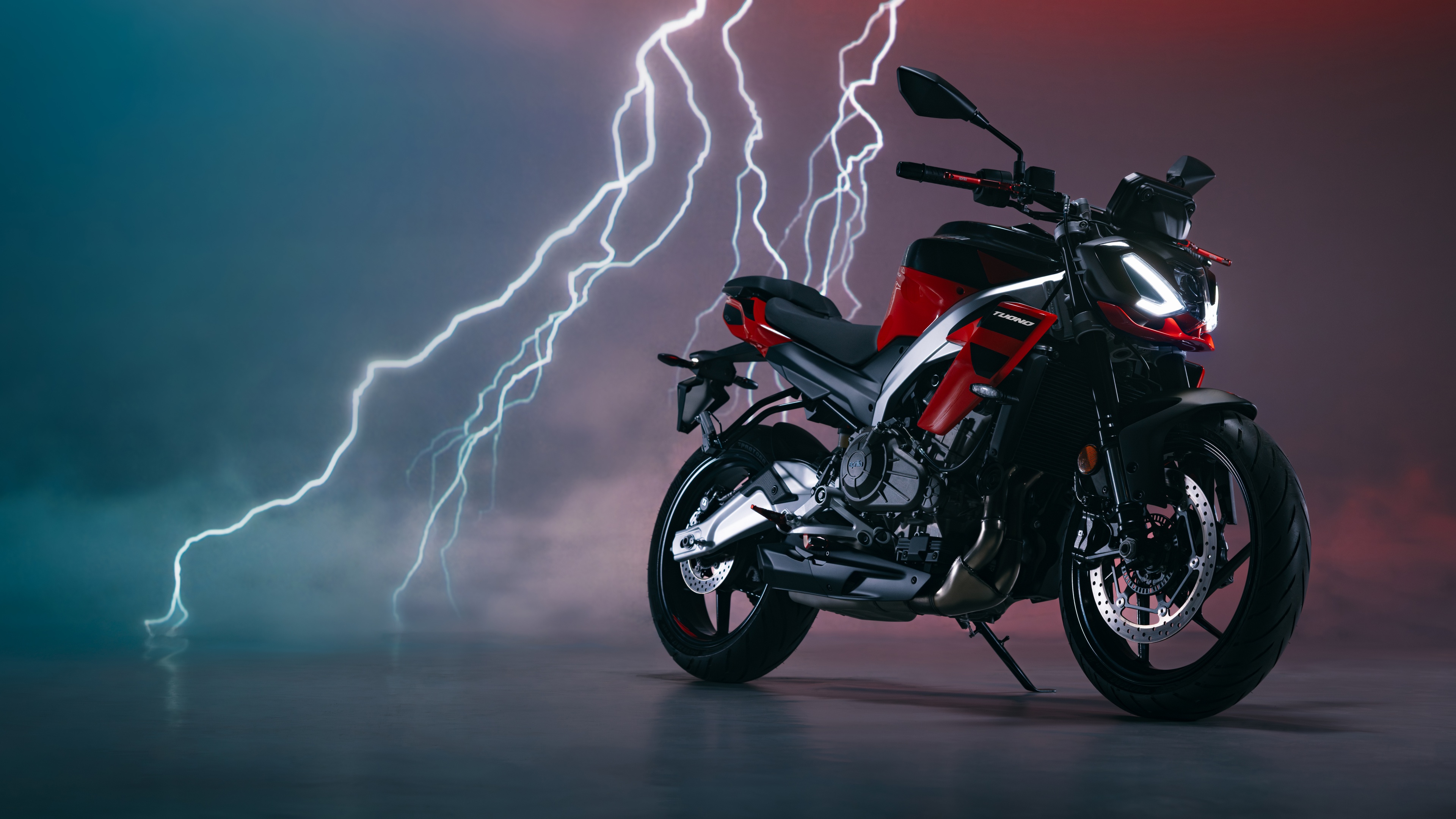 A detailed view of the 2025 Aprilia Tuono 457 naked streetfighter motorcycle.
