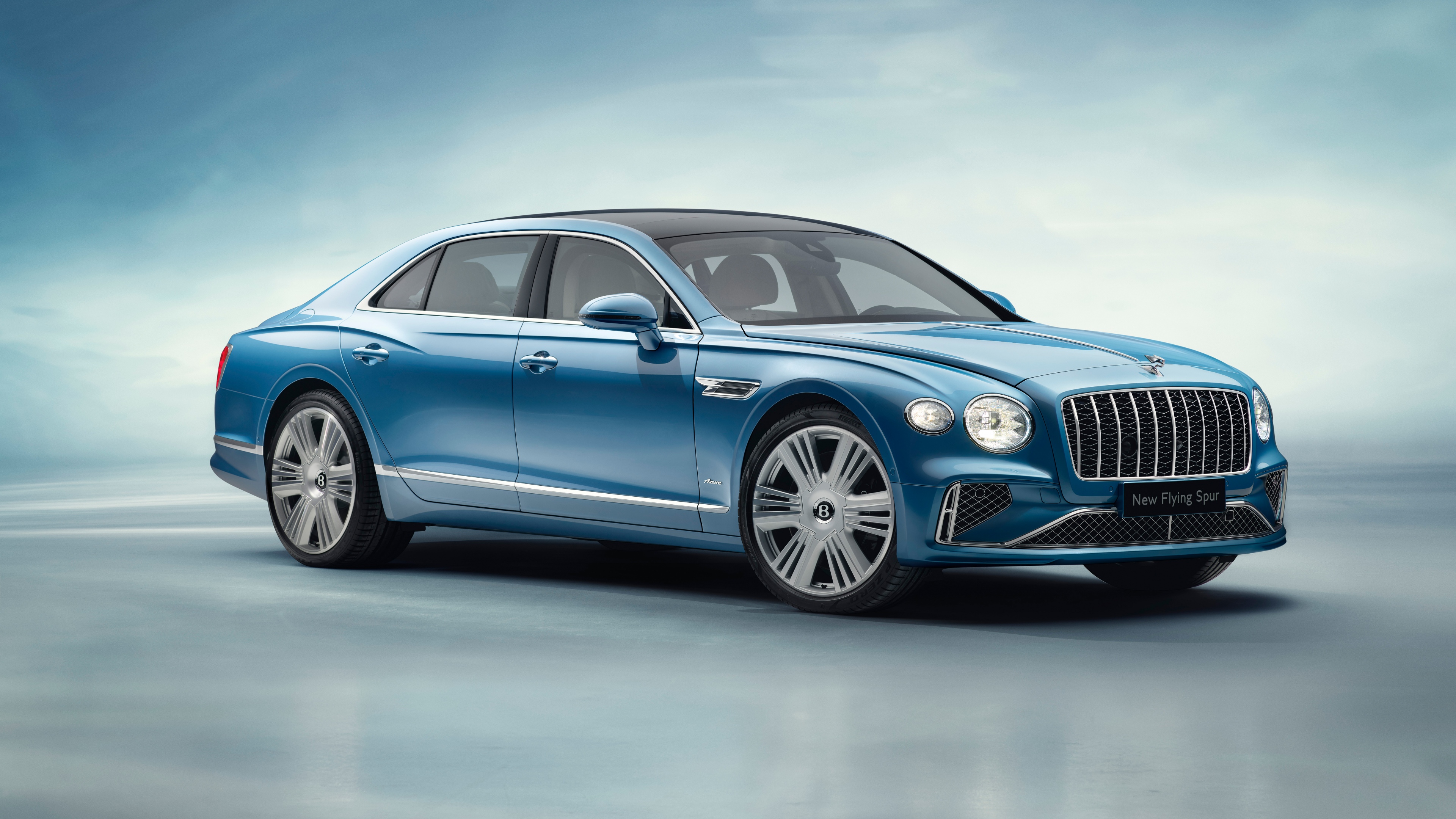 A high-definition, close-up shot of the 2025 Bentley Flying Spur Azure luxury sedan.