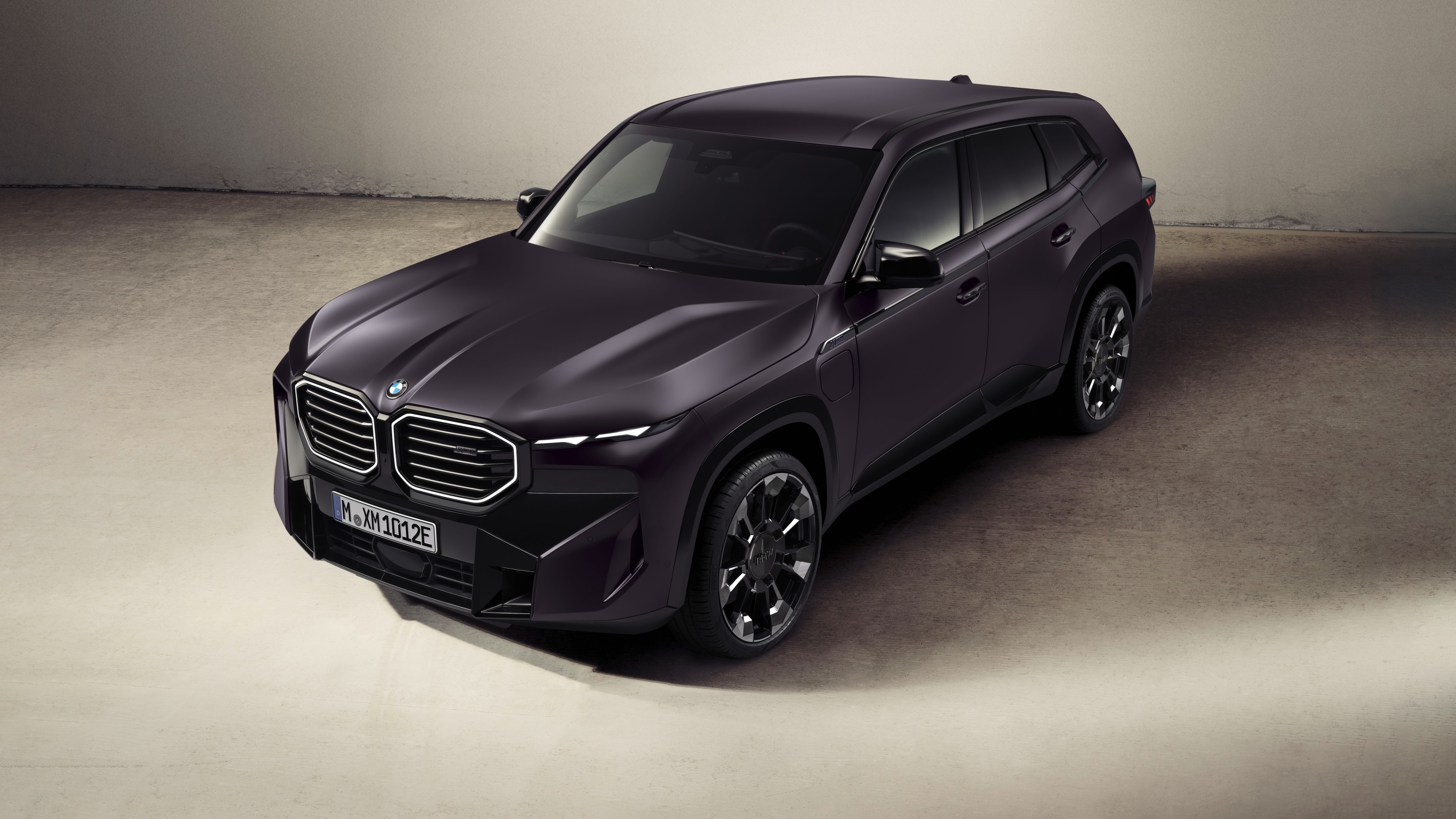 A stunning close-up of the 2025 BMW XM luxury plug-in hybrid SUV in high detail.
