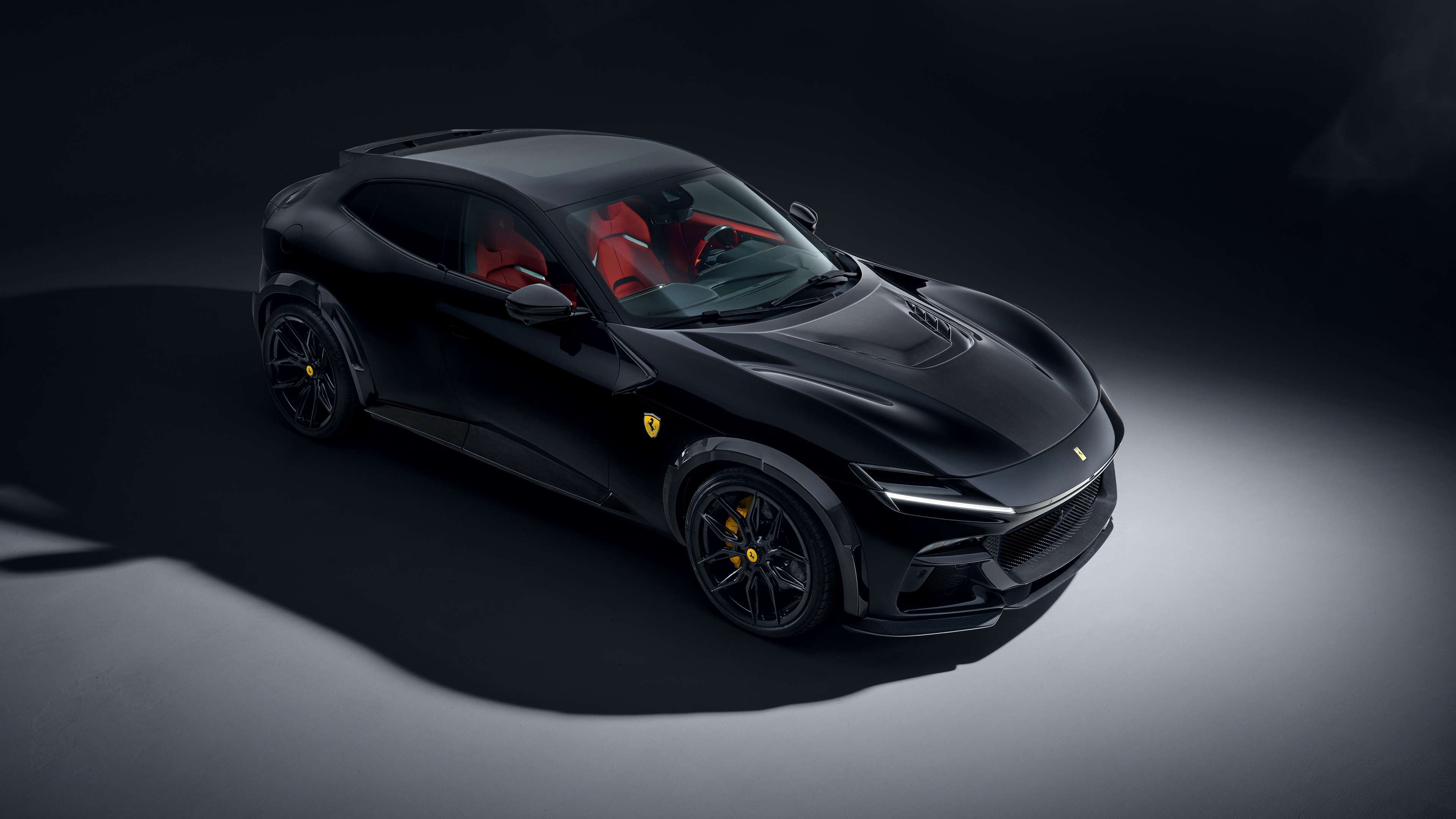 A 2025 Ferrari Purosangue in a sleek black finish, set against a dark, minimalist background.