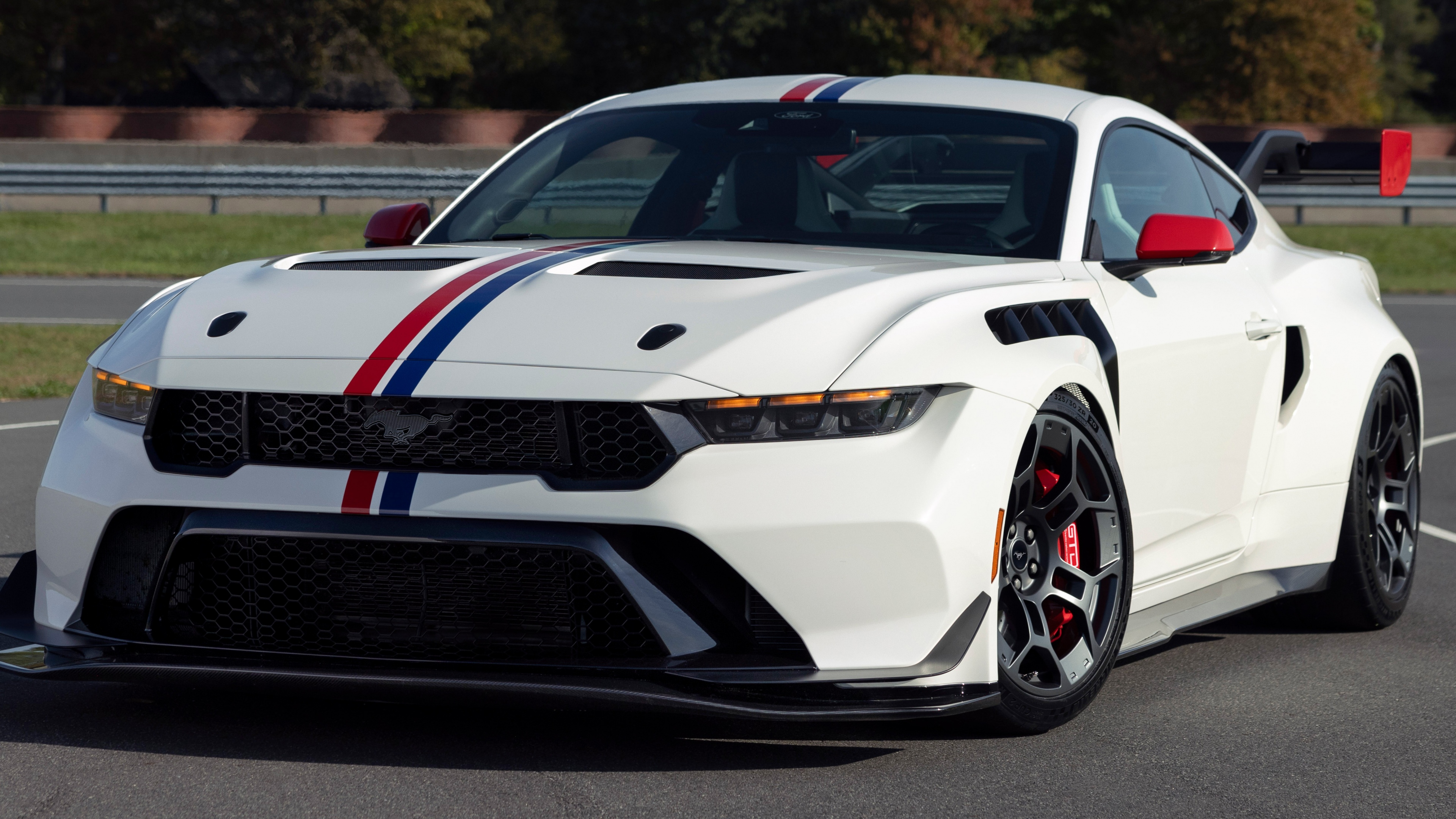A cinematic ultra-wide 5K view of the 2025 Ford Mustang GTD sports car showcasing its aerodynamic design.
