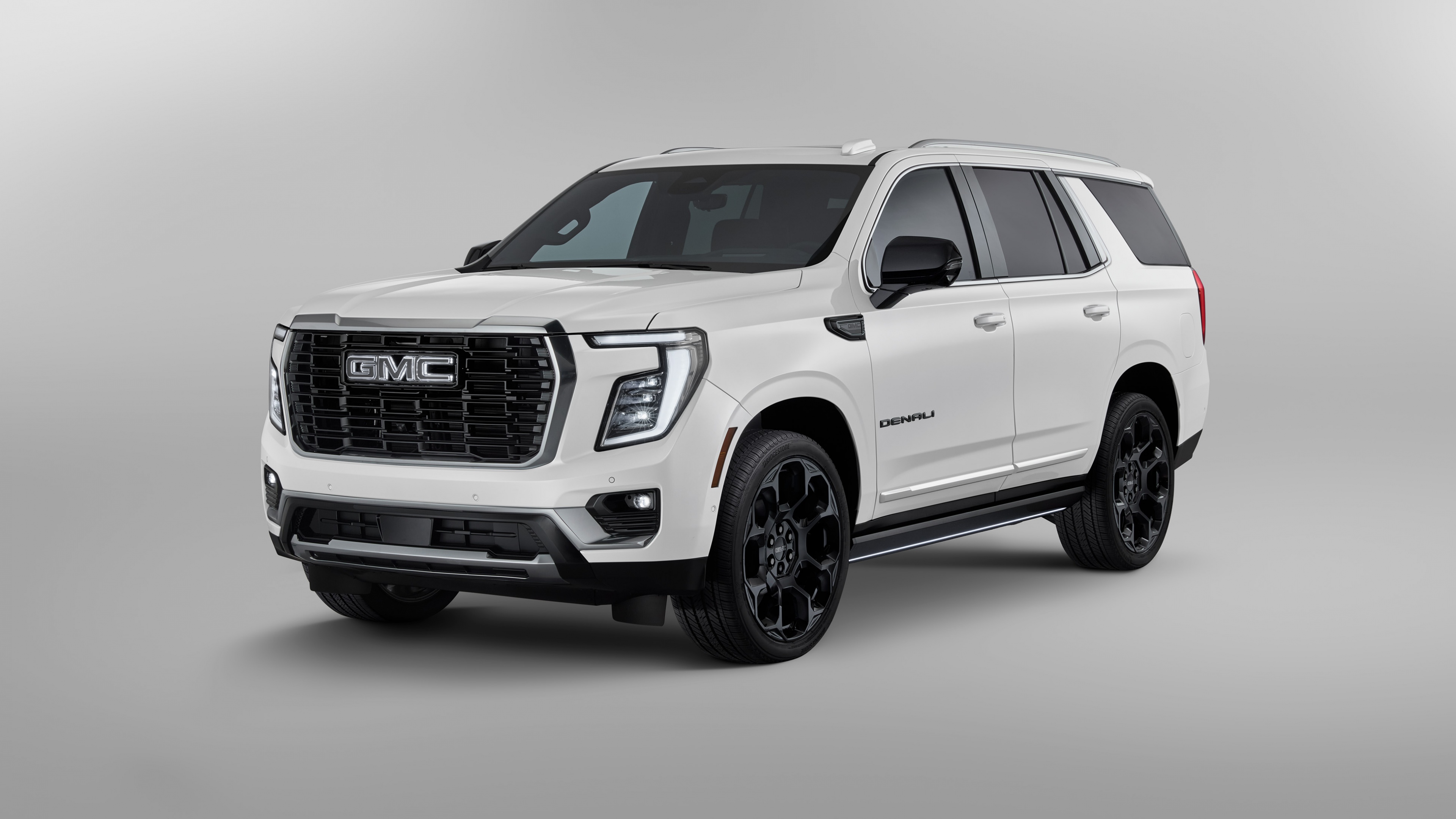 2025 GMC Yukon Denali 25th Anniversary Edition luxury SUV isolated on a white background