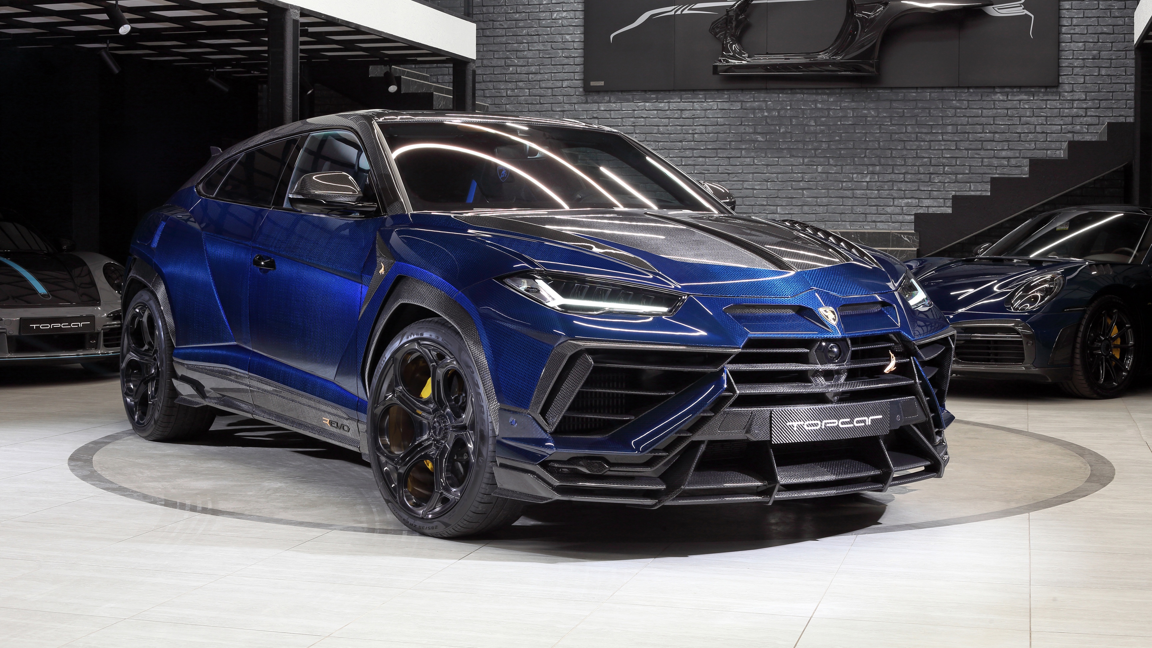 A high-resolution 5K close-up of the 2025 Lamborghini Urus R’Evo showcasing its sleek aerodynamic body and luxury design.