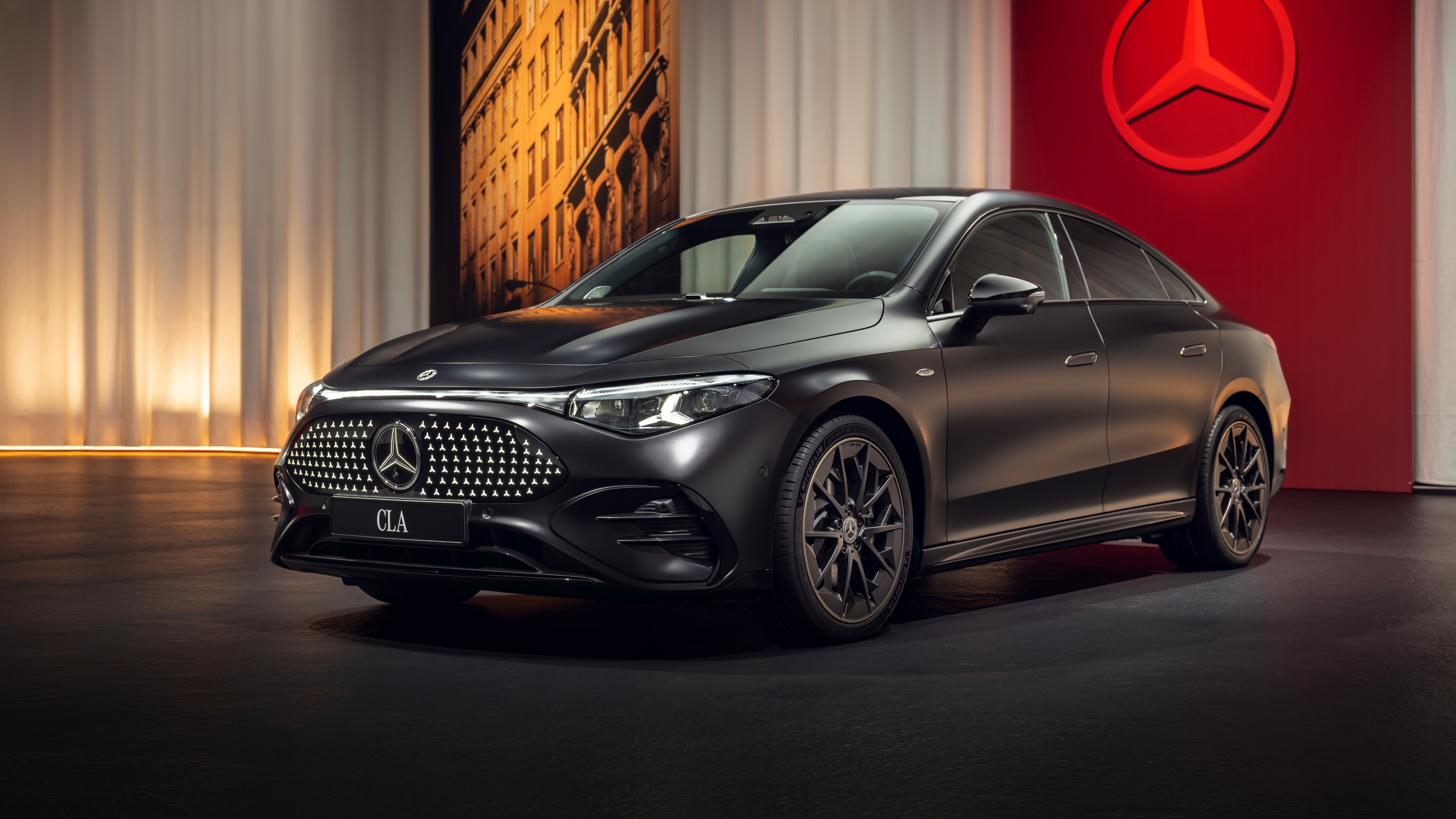 A high-resolution, close-up view of a sleek 2025 Mercedes-Benz with AMG Line trim, highlighting its aerodynamic body and premium finish.