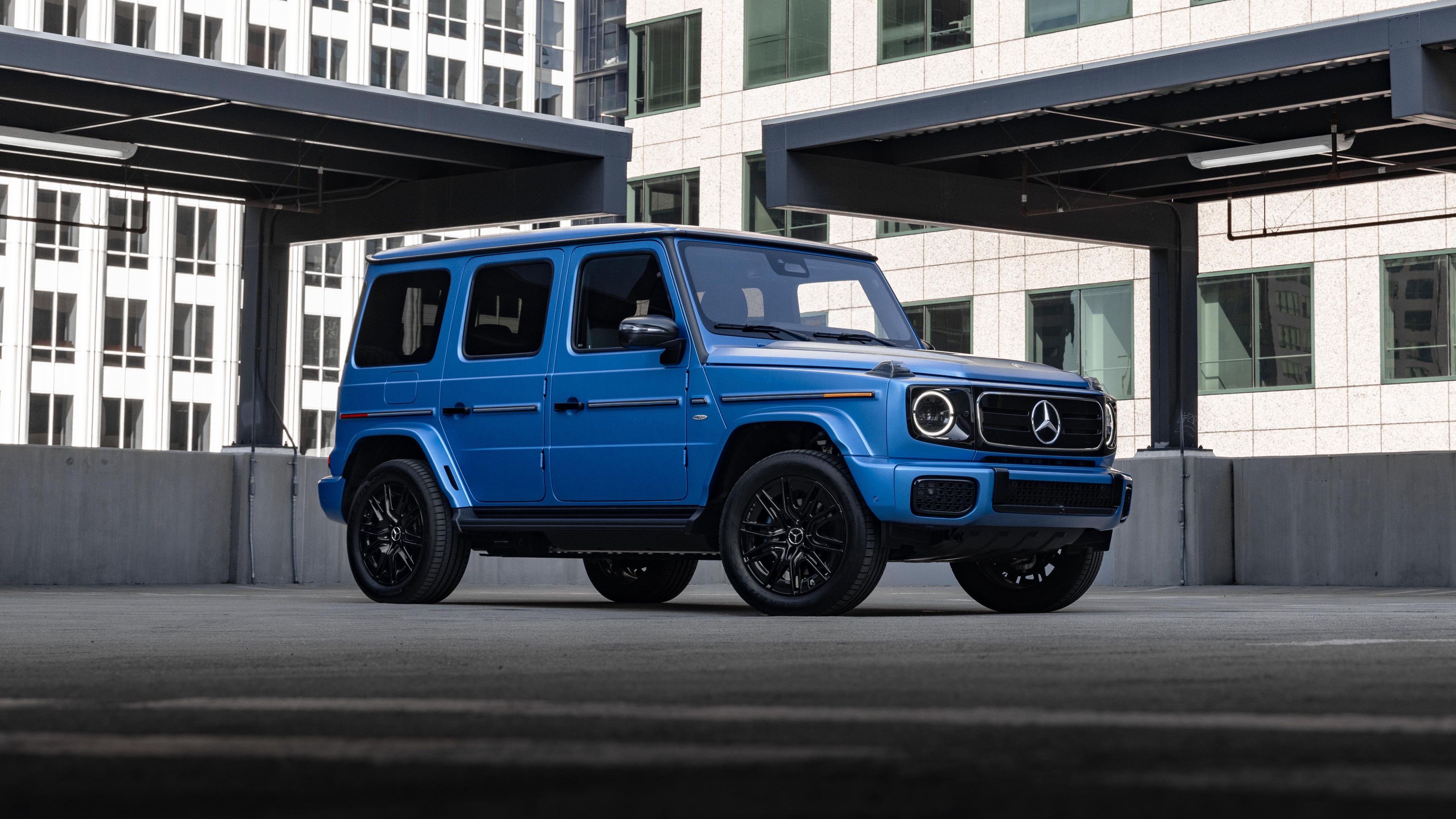 A high-resolution view of the 2025 Mercedes-Benz G 580 electric SUV, highlighting its rugged yet sophisticated design and sleek metallic body.