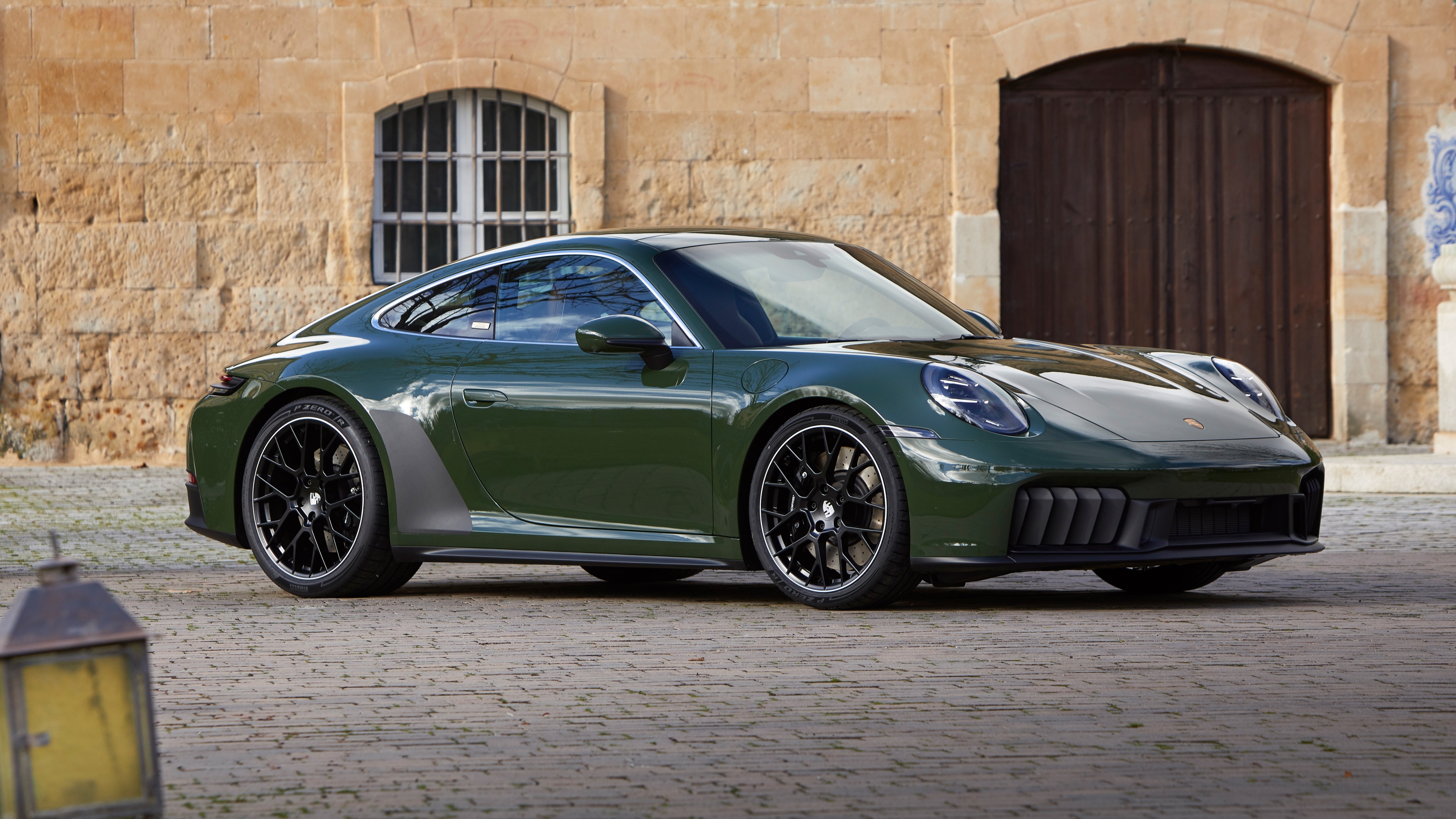 Close-up of a sleek, modern 2025 Porsche 911 Carrera GTS in high detail.