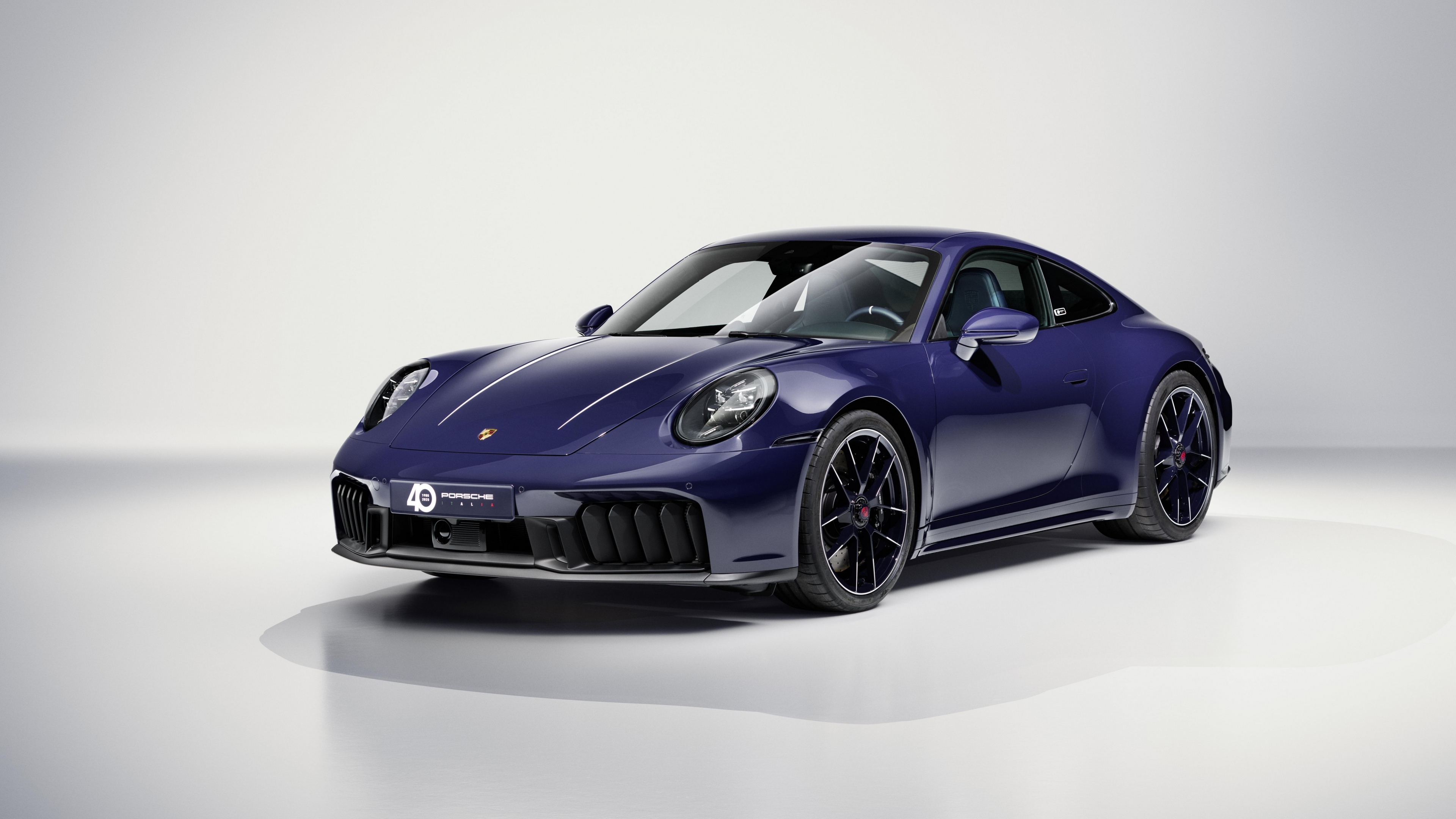 A pristine 2025 Porsche 911 Carrera GTS Special Edition sports car centered against a clean white studio background.
