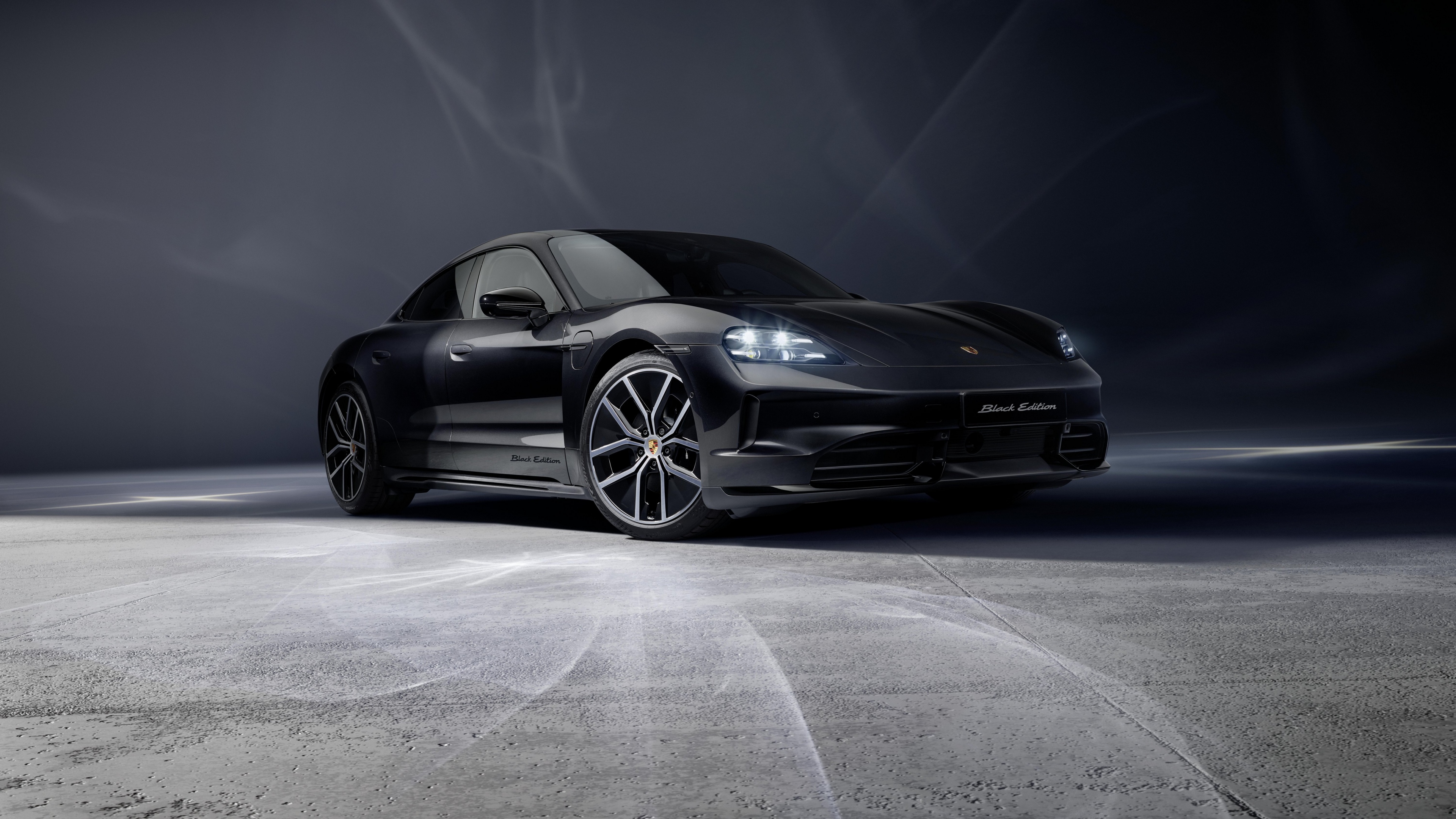 A sleek and polished 2025 Porsche Taycan 4S Black Edition featuring an all-black exterior and premium finish.