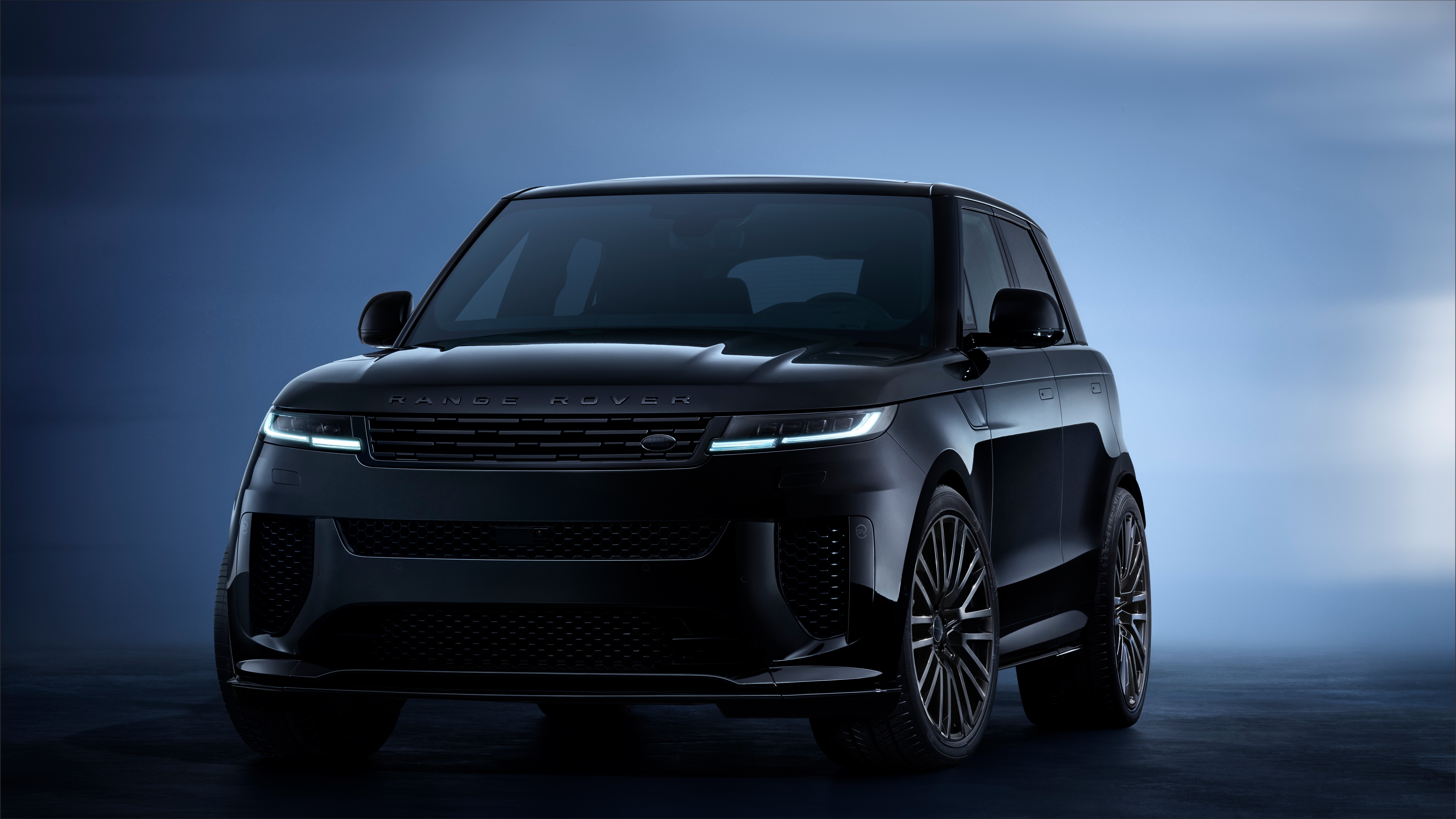 A high-resolution, sleek all-black 2025 Range Rover Sport SV Black Edition luxury SUV.