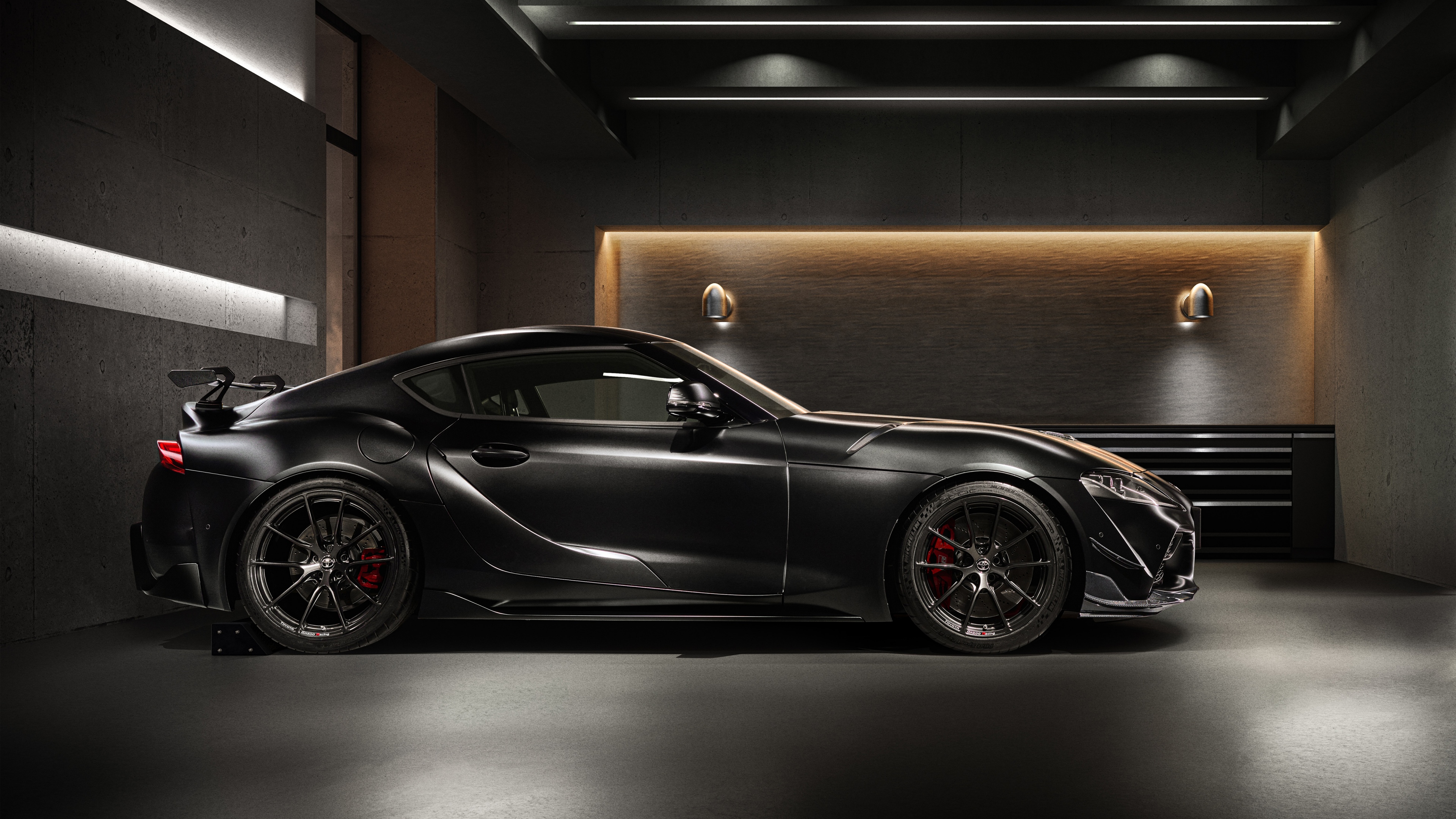 A cinematic studio shot of the 2025 Toyota GR Supra A90 Final Edition with a dark, moody aesthetic.