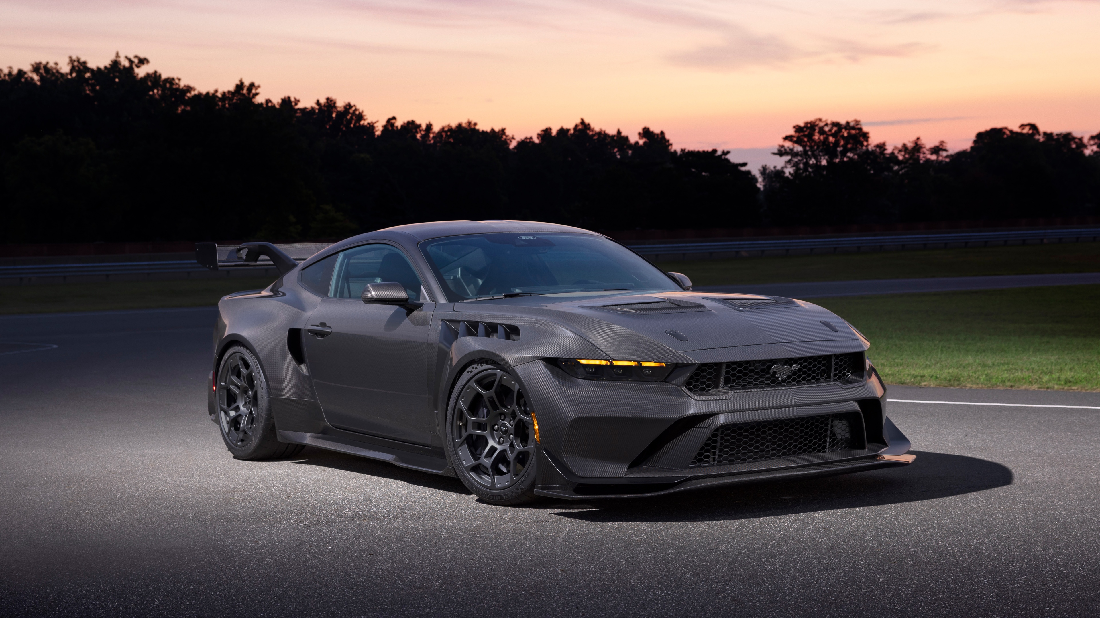 A high-resolution, detailed close-up of the 2026 Ford Mustang GTD featuring aggressive aerodynamic elements and a sleek metallic finish.