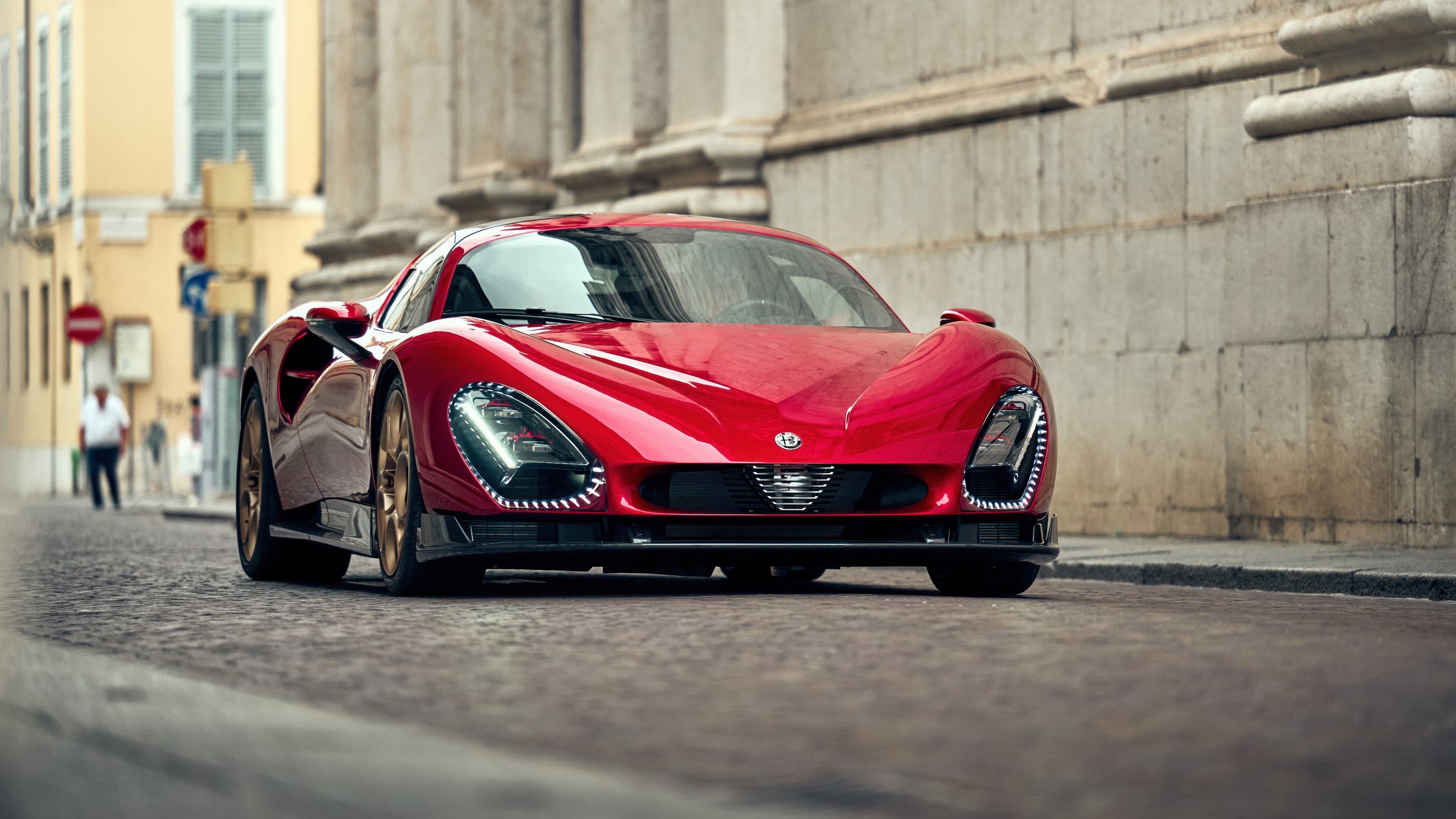 High-resolution shot of a classic red Alfa Romeo 33 Stradale supercar.