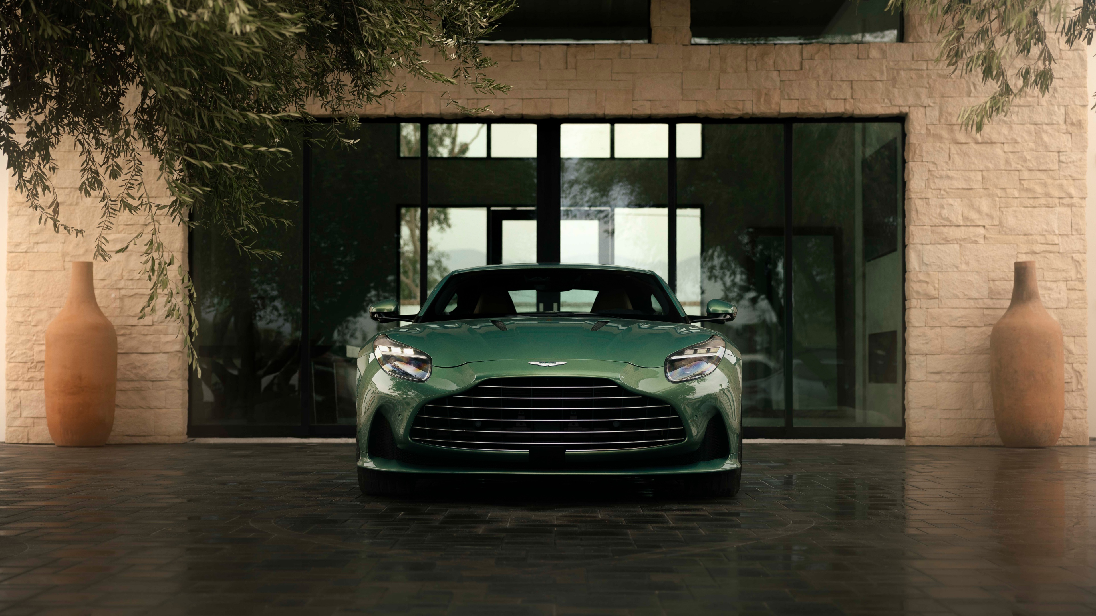 A high-definition, ultra-detailed view of a sleek Aston Martin DB12 supercar, showcasing its premium metallic finish and aerodynamic design.
