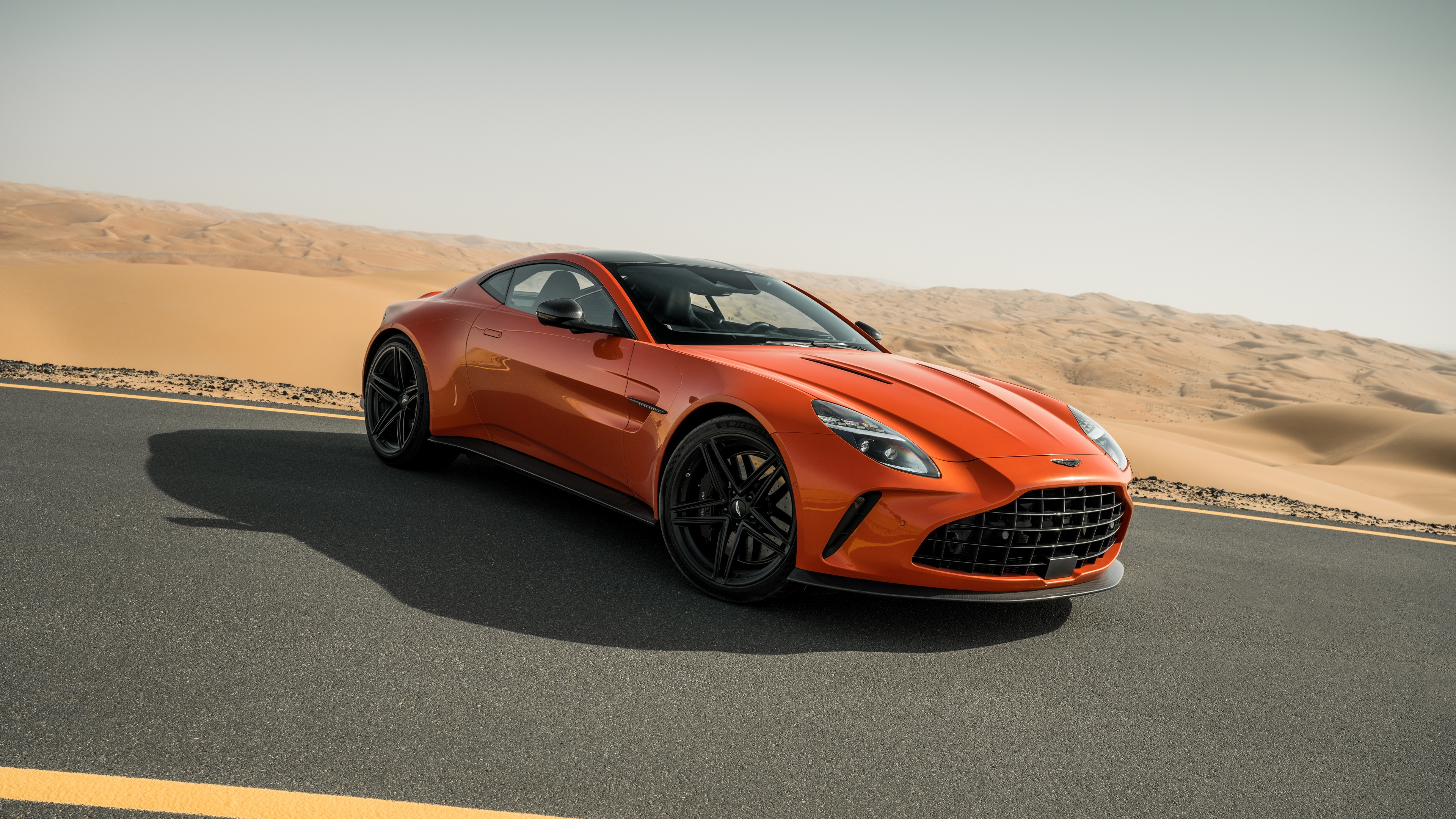 A high-detail, ultra-HD shot of a sleek Aston Martin Vantage luxury sports car.