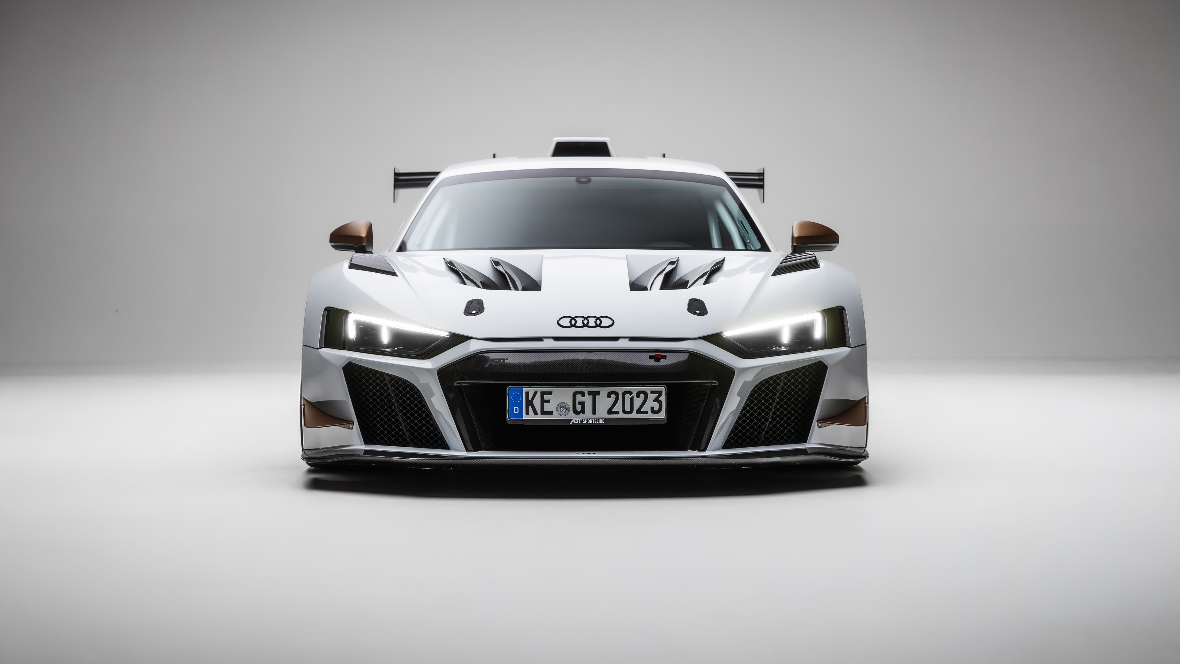 A sleek Audi R8 supercar positioned against a pure white background.