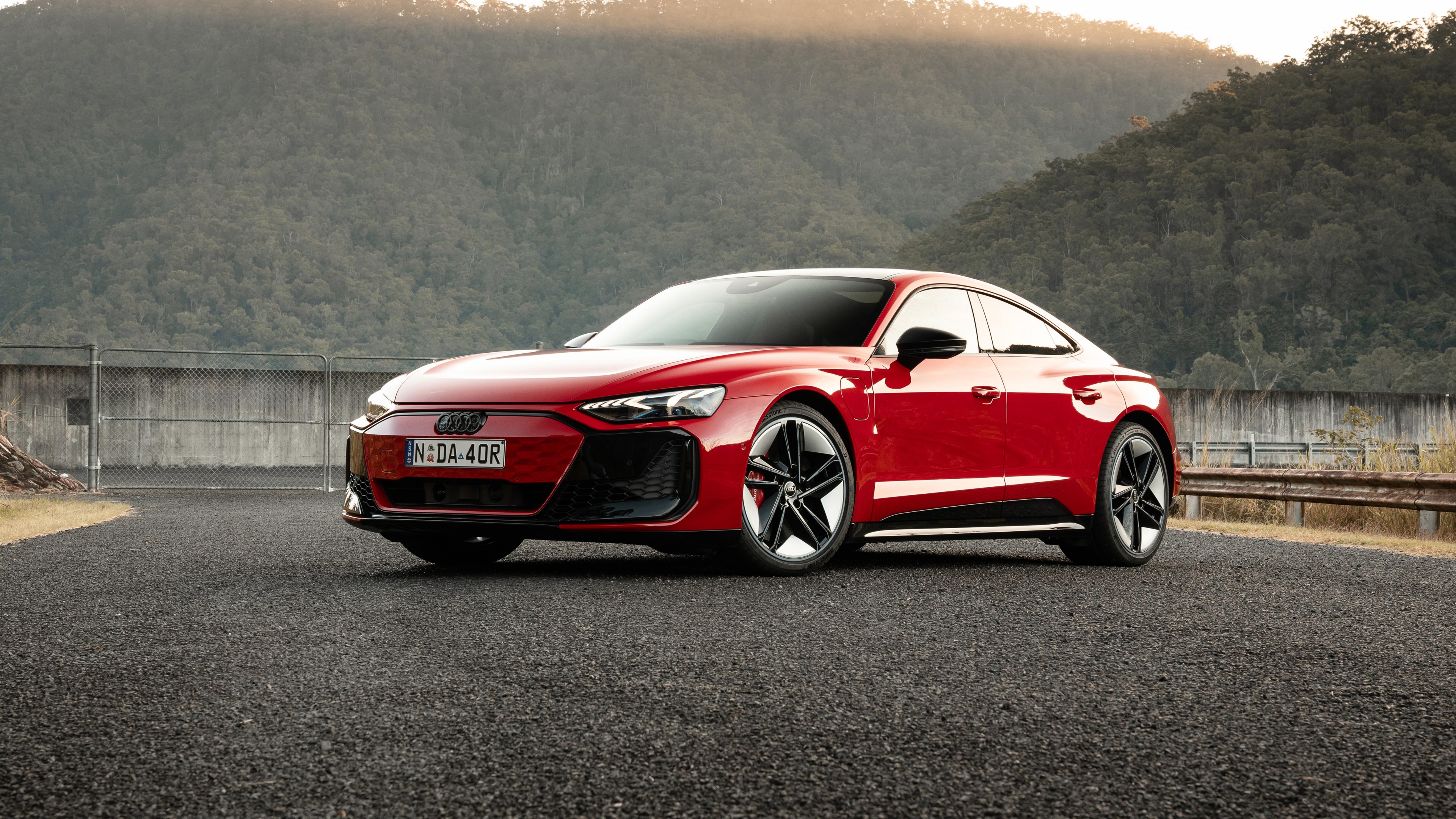 A high-detail shot of a red Audi RS e-tron GT electric sports sedan.