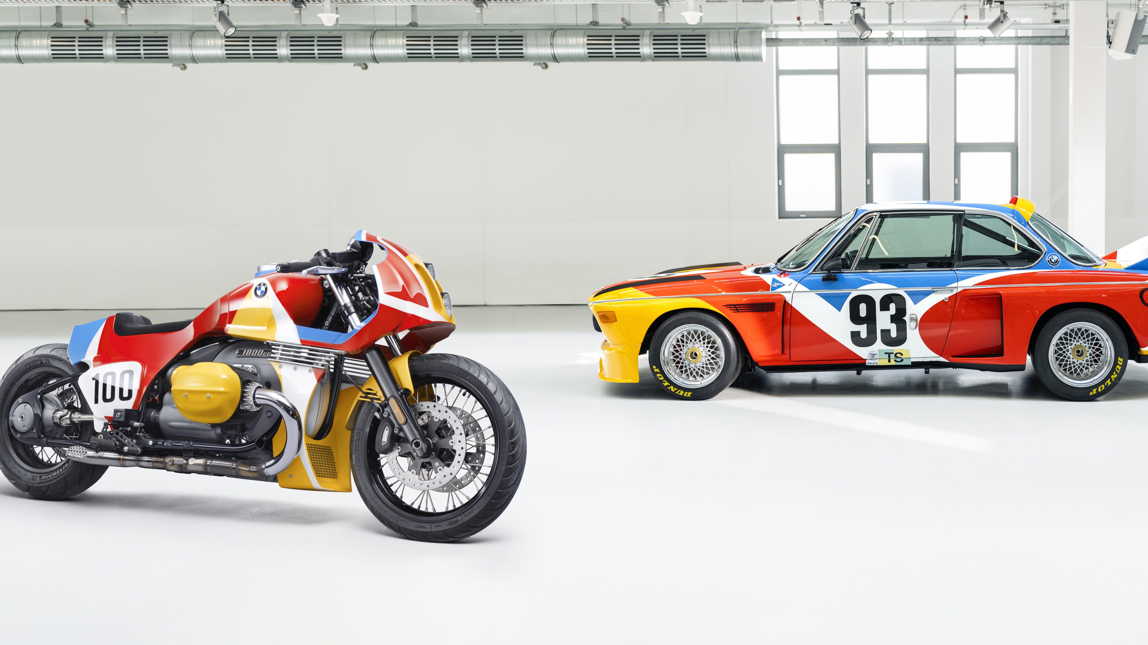 A highly detailed custom BMW 1.8 CSL art bike featuring intricate artistic livery and sleek automotive design elements.