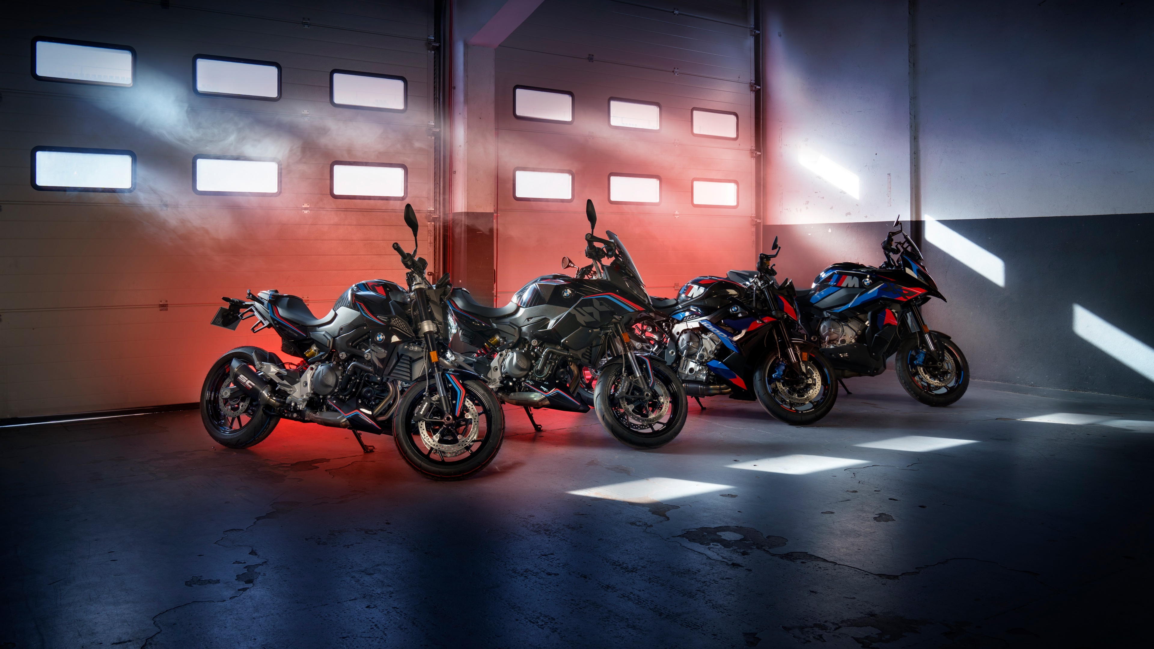 A high-resolution collection of premium BMW motorcycles, including the M 1000 R and F 900 R models, showcasing advanced sports bike design and engineering.