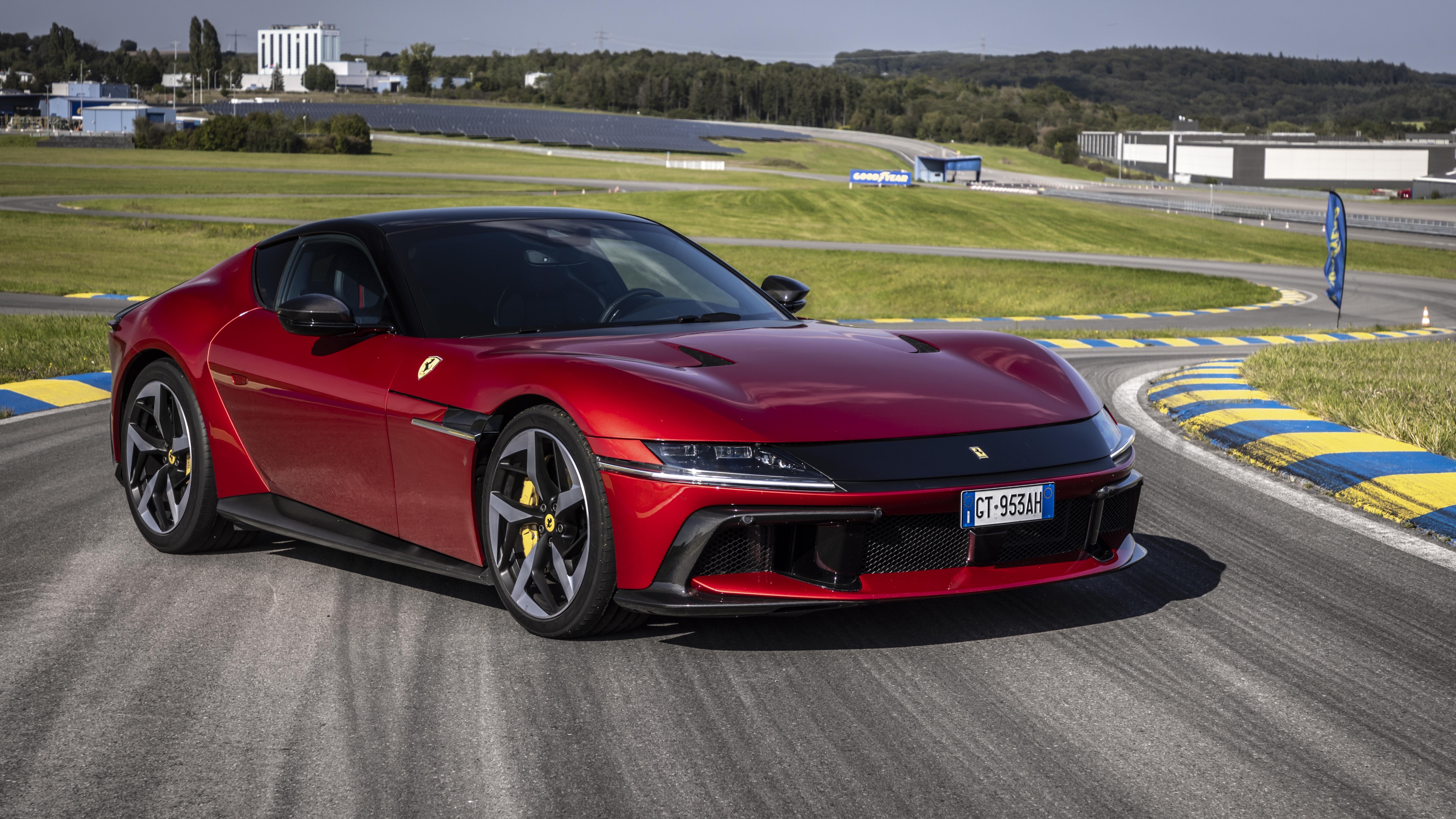 A high-detail shot of a Ferrari 12Cilindri driving fast on a professional racing circuit.