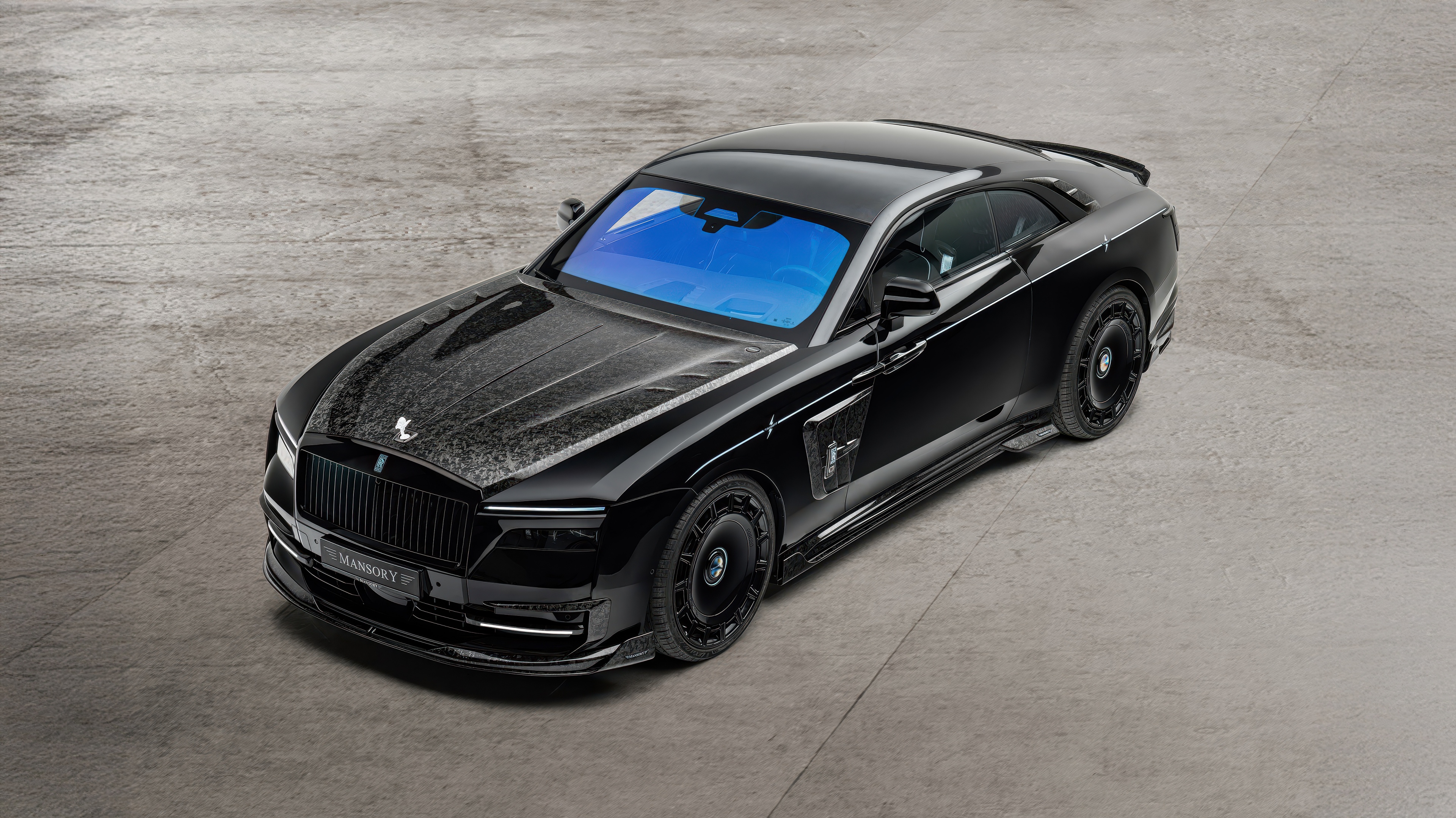 A high-resolution, close-up shot of a luxurious black Rolls-Royce Spectre featuring a sleek and polished exterior.