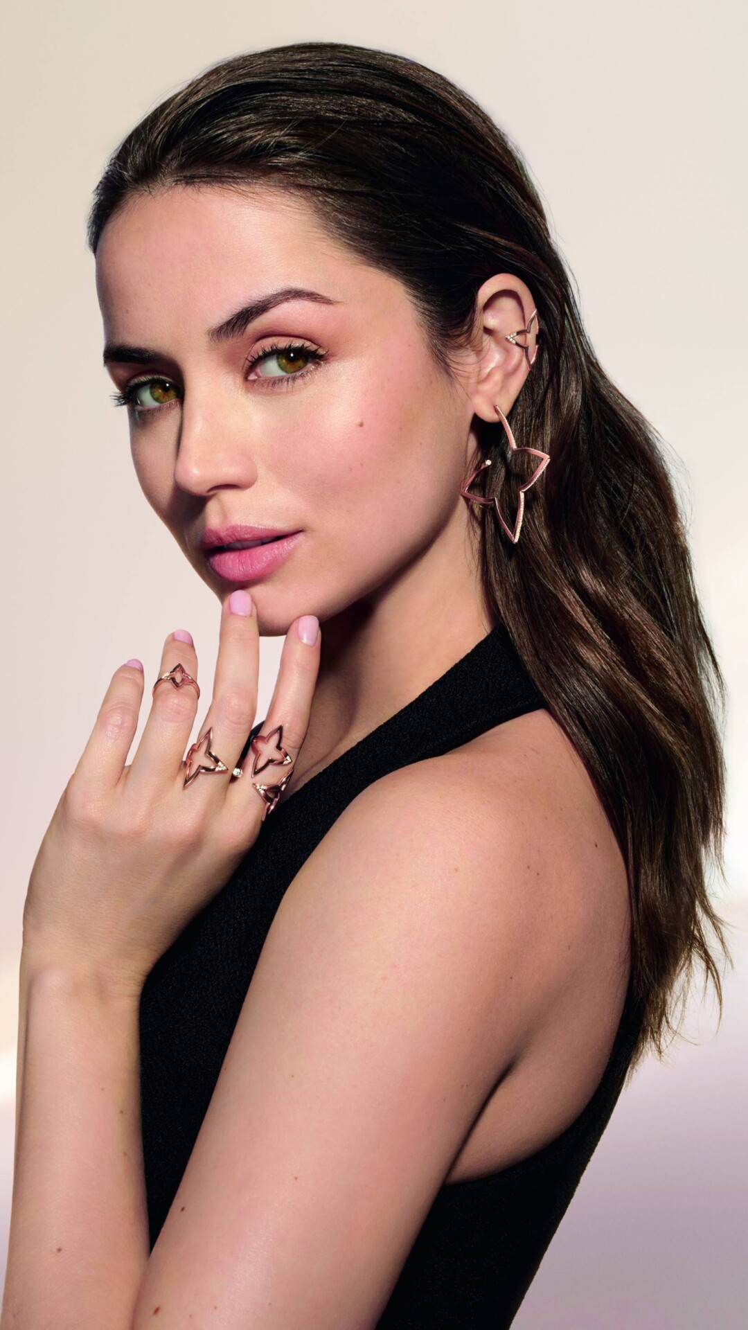 A sophisticated and elegant close-up portrait of actress Ana de Armas.
