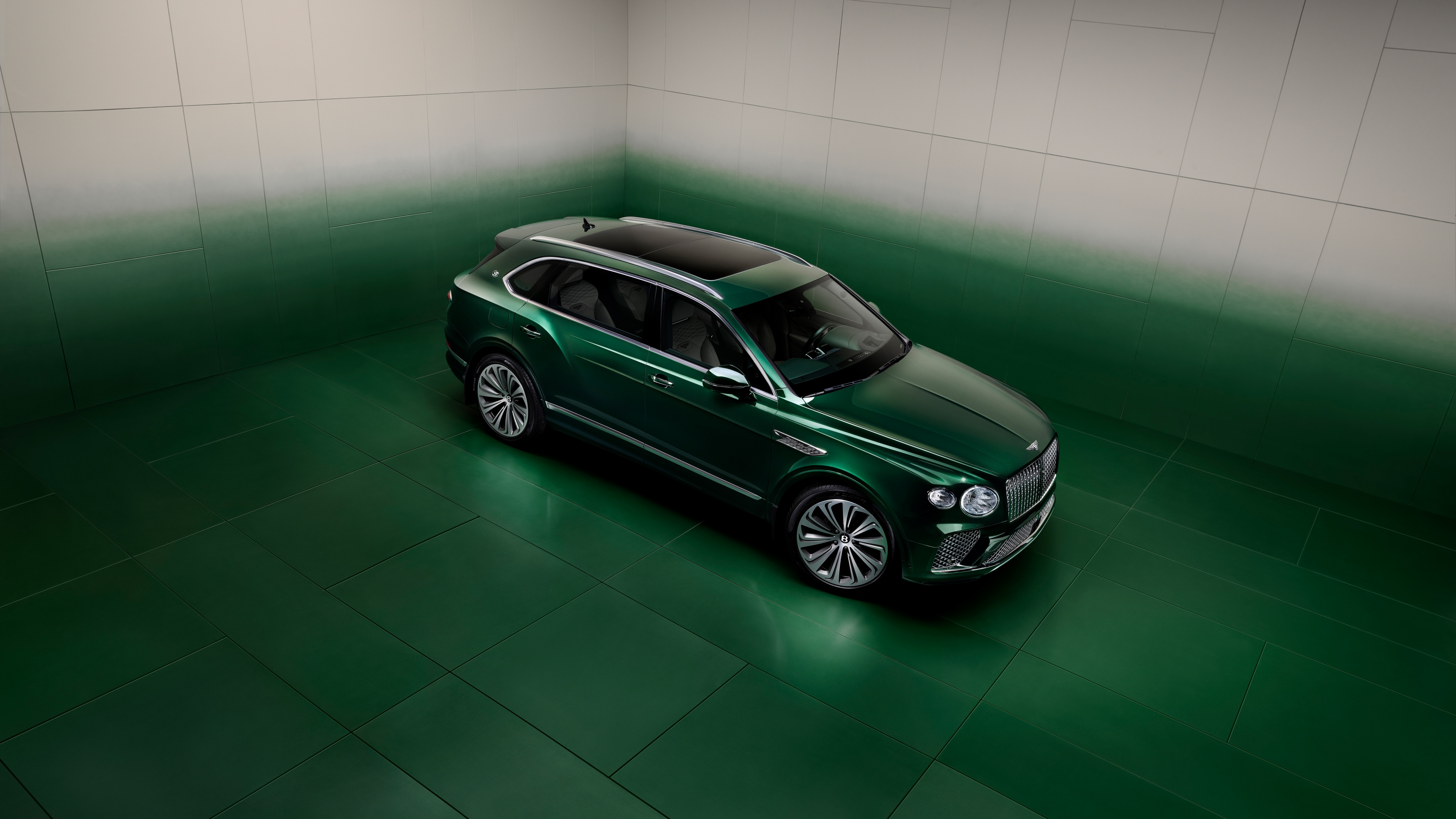 A luxurious bespoke vehicle design featuring a deep emerald green aesthetic and high-resolution metallic details.