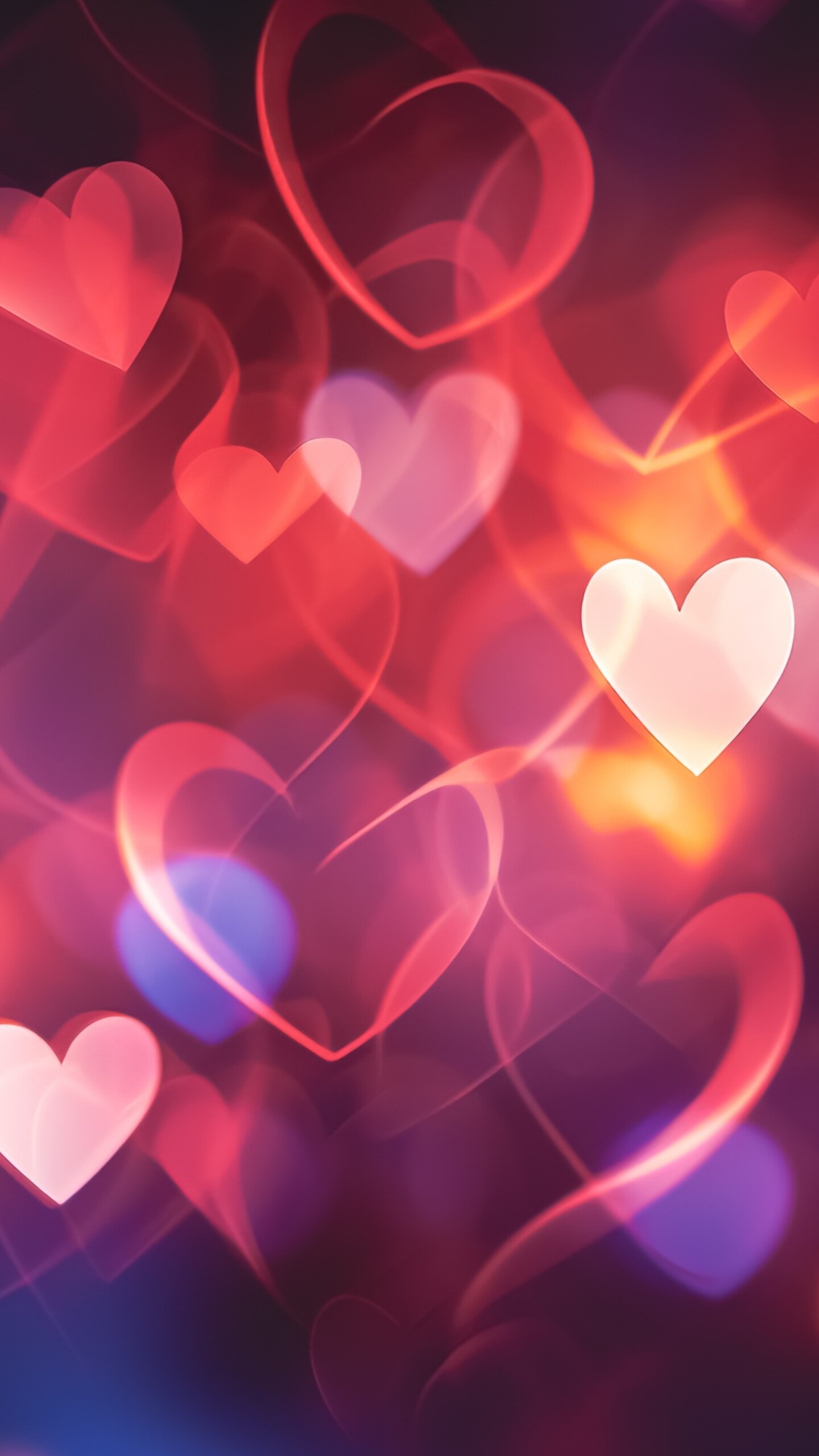 A dreamy collection of colorful hearts set against a soft, out-of-focus bokeh background.