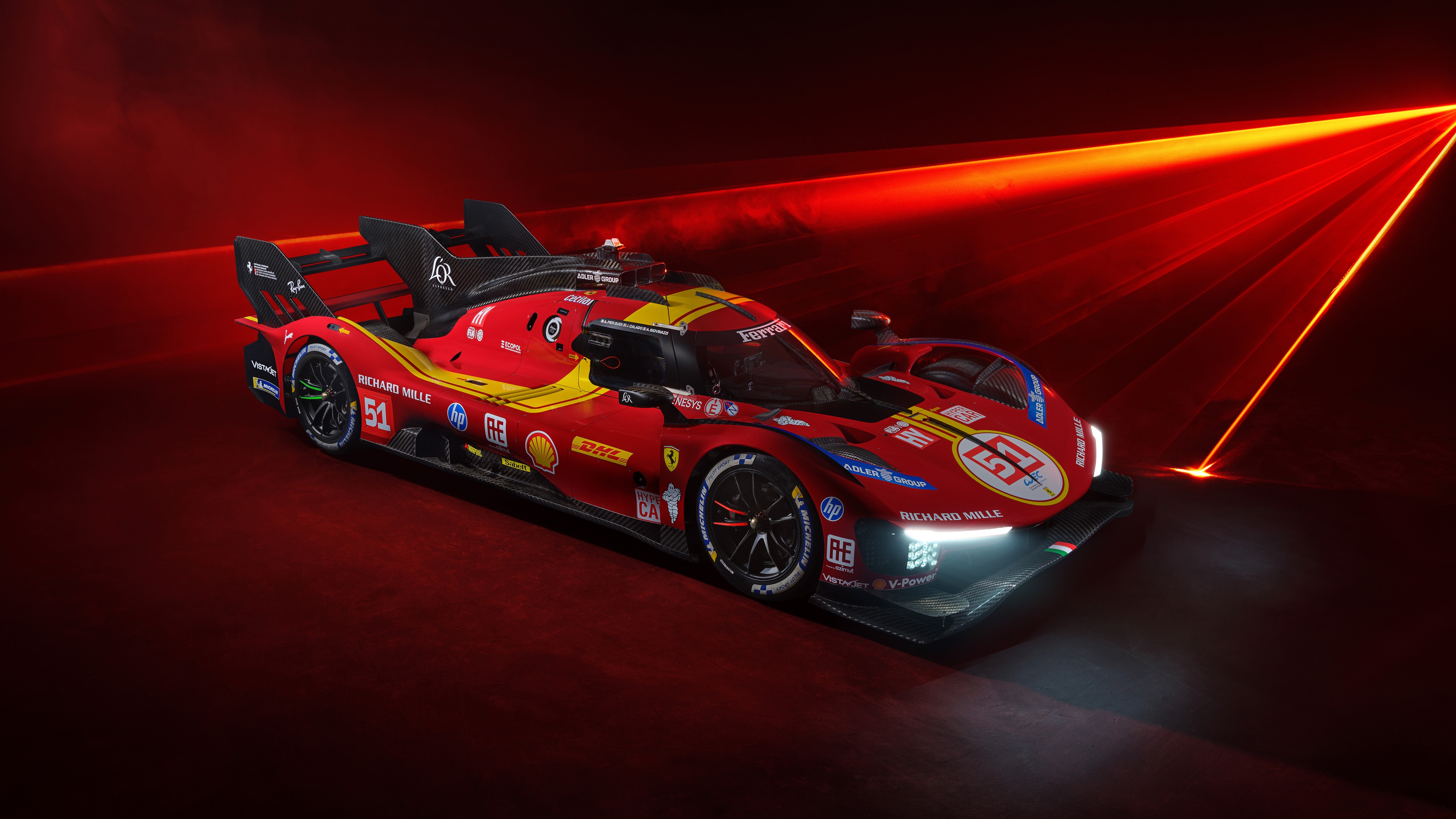Close-up view of the Ferrari 499P Le Mans Hypercar on a professional racing circuit.