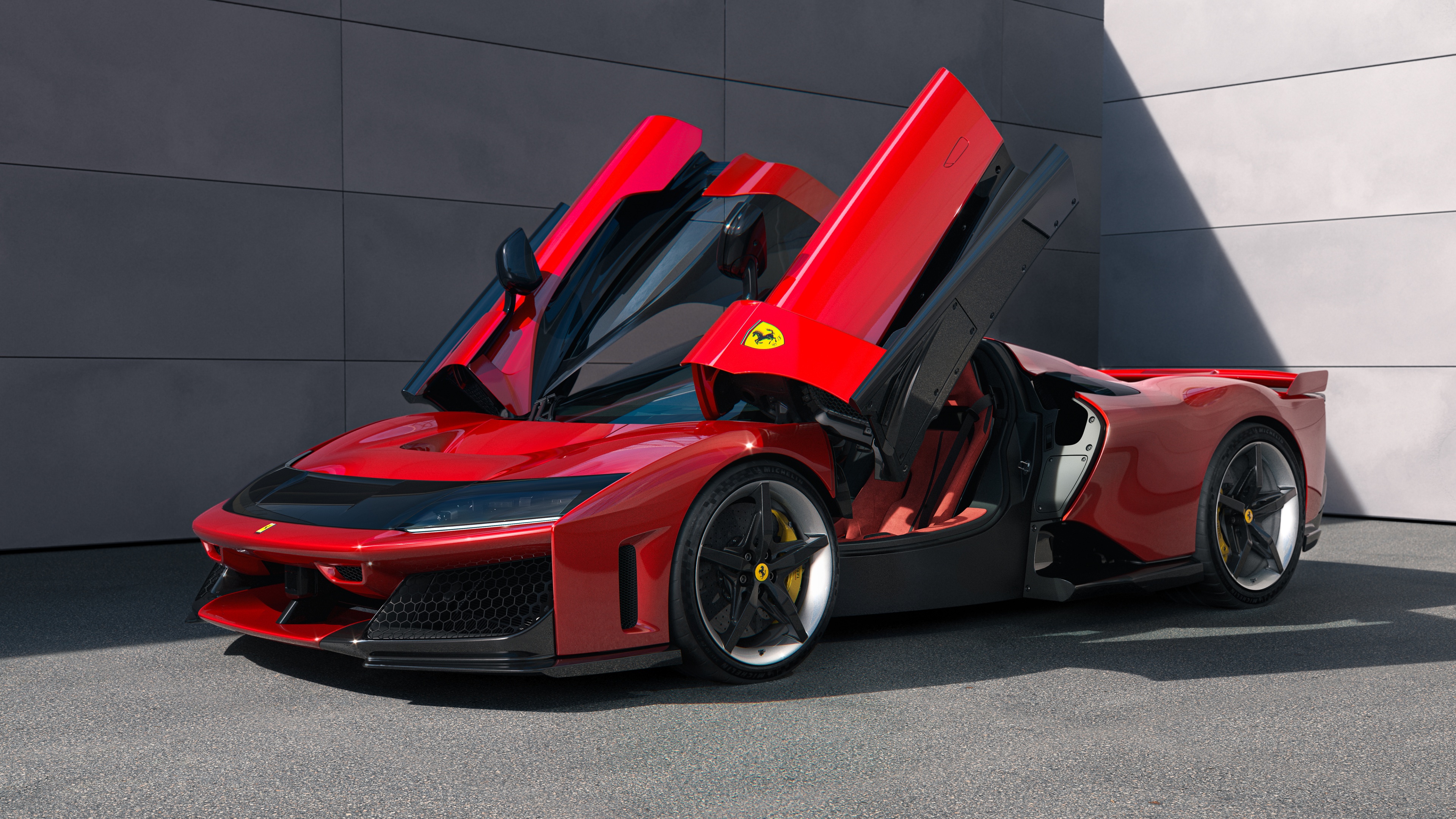 A sleek and aerodynamic 2025 Ferrari F80 supercar in a striking vibrant red color.