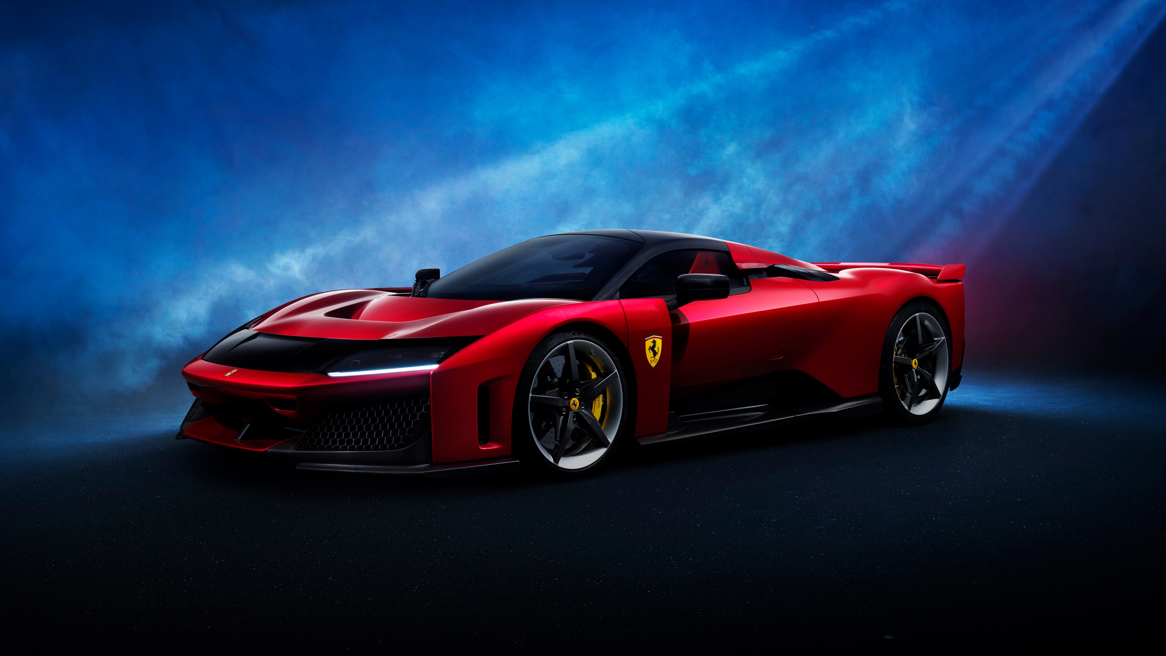 A sleek red Ferrari F80 supercar centered against a solid blue backdrop.