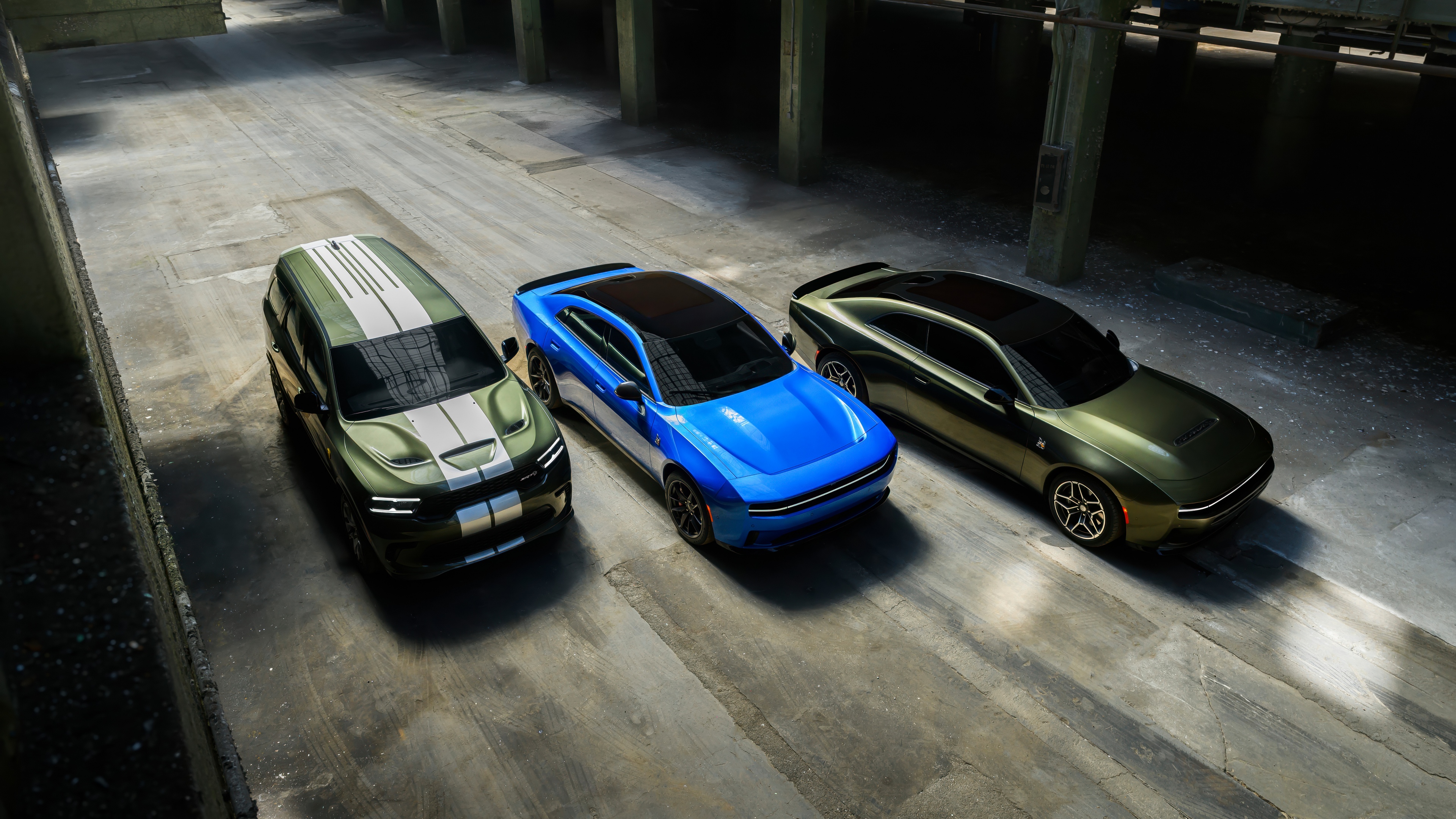 A high-resolution shot of a modern 2026 Dodge Charger Daytona Scat Pack and Dodge Durango muscle cars featuring aggressive styling.