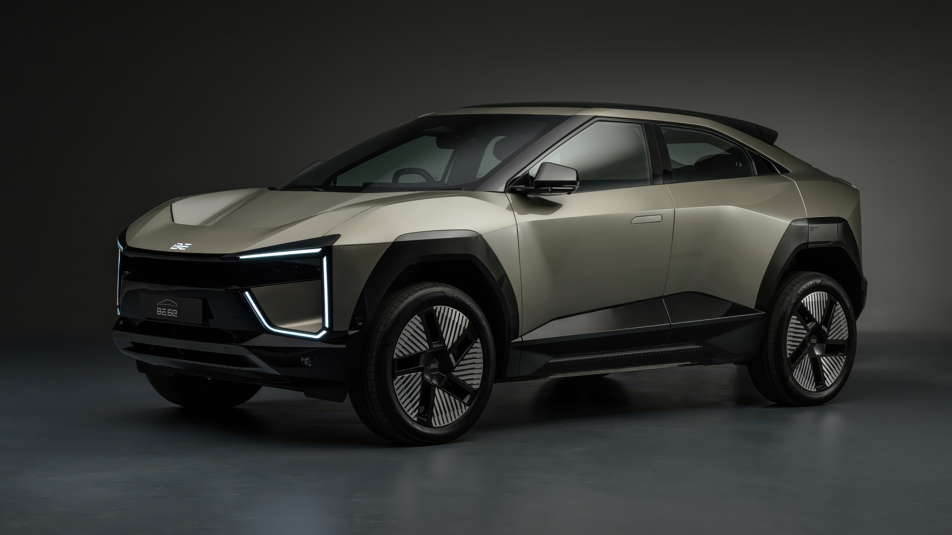 A high-resolution view of a modern electric SUV concept car featuring futuristic lines and advanced LED headlight technology.