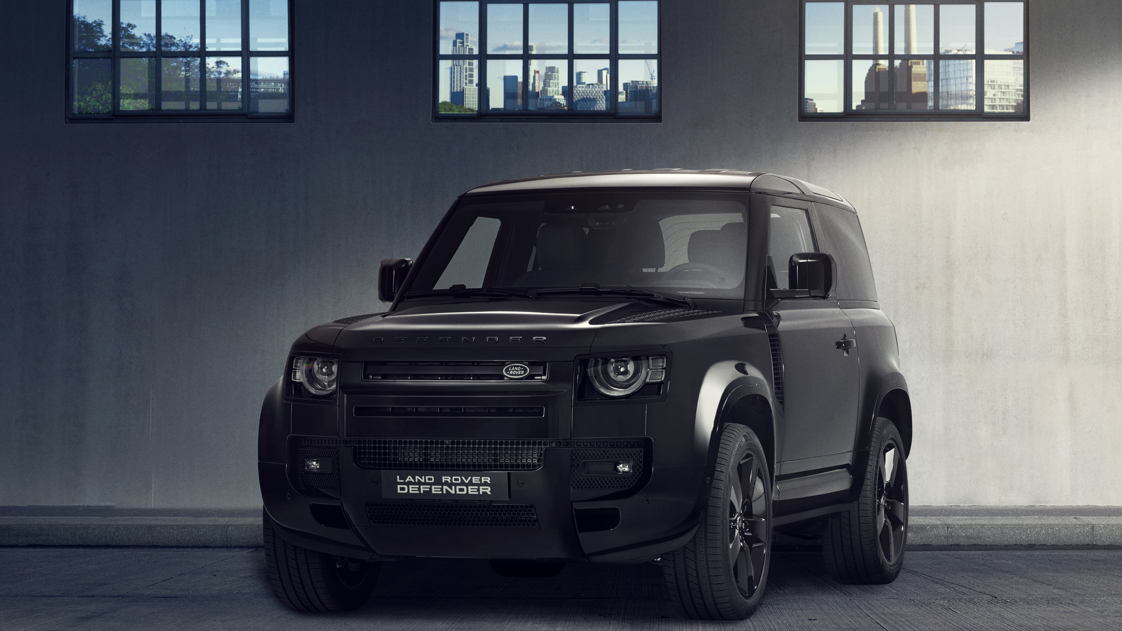 A collection of high-end, glossy black cars with futuristic aerodynamic designs in a high-definition 8K setting.