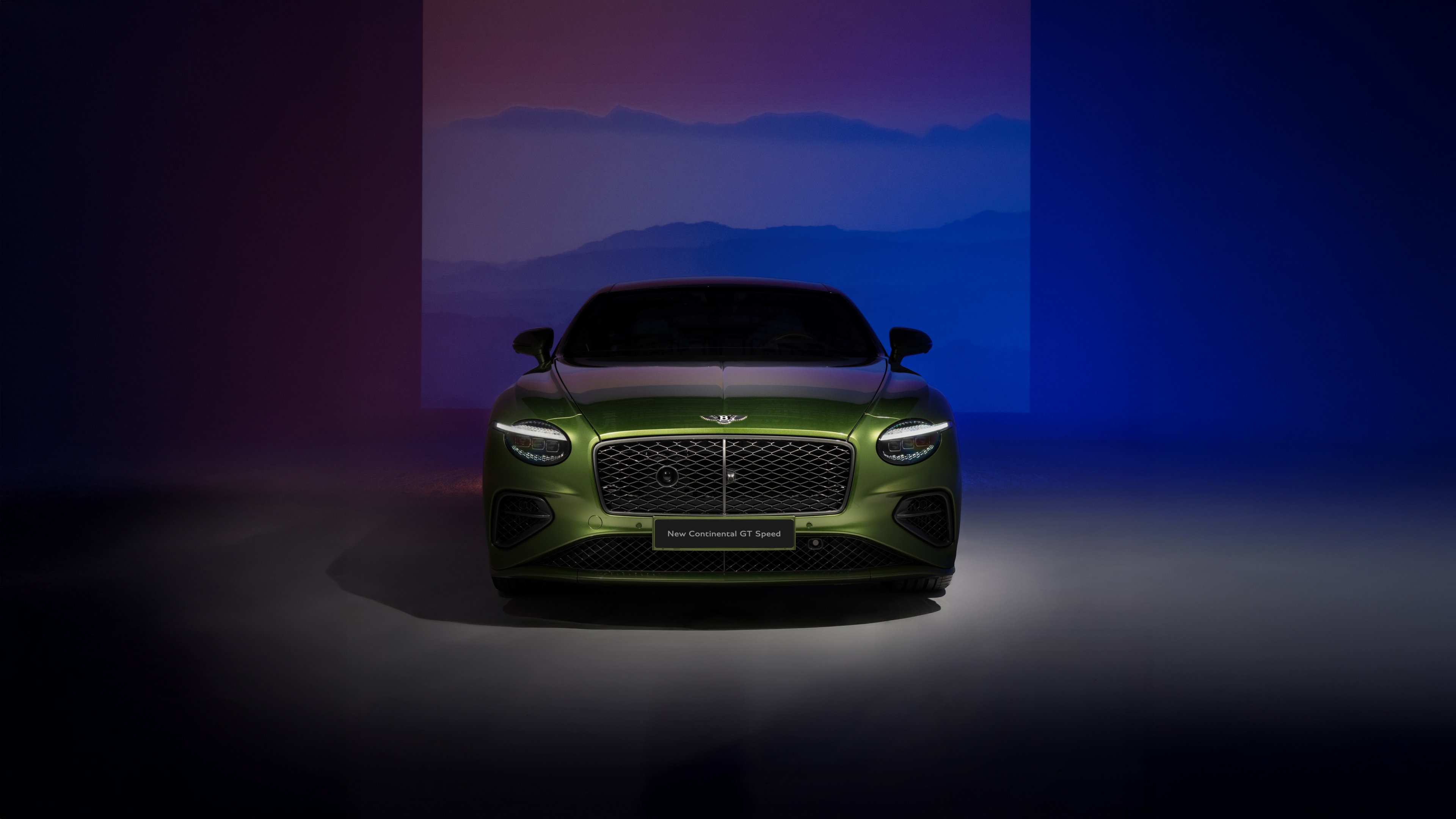 Front view of a luxury green Bentley Continental GT Speed