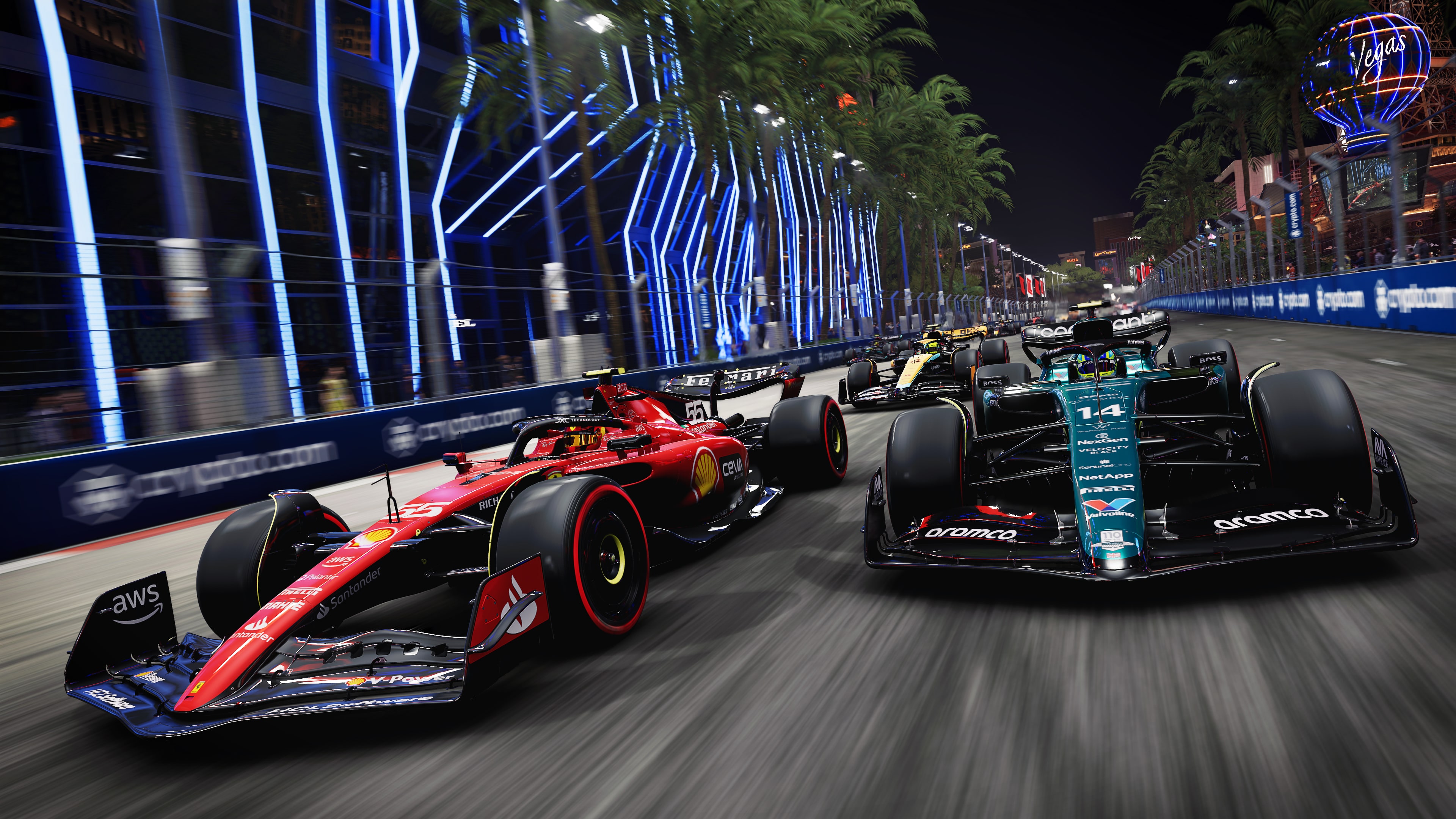 Formula 1 racing cars speeding around a curve on a professional asphalt race track during the 2023 Games.