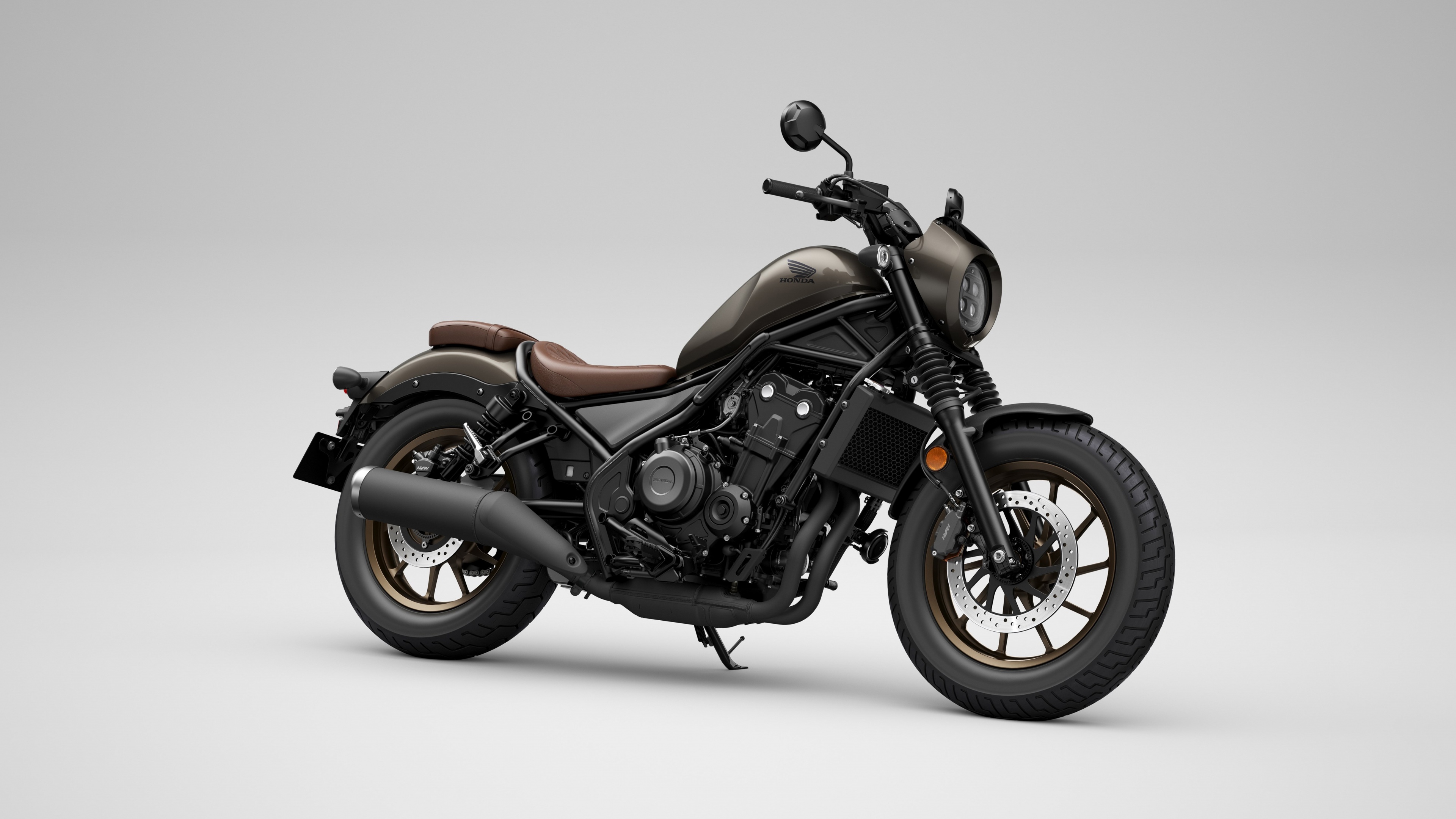 A high-resolution close-up of a Honda CMX500 Rebel cruiser motorcycle featuring a sleek black design.