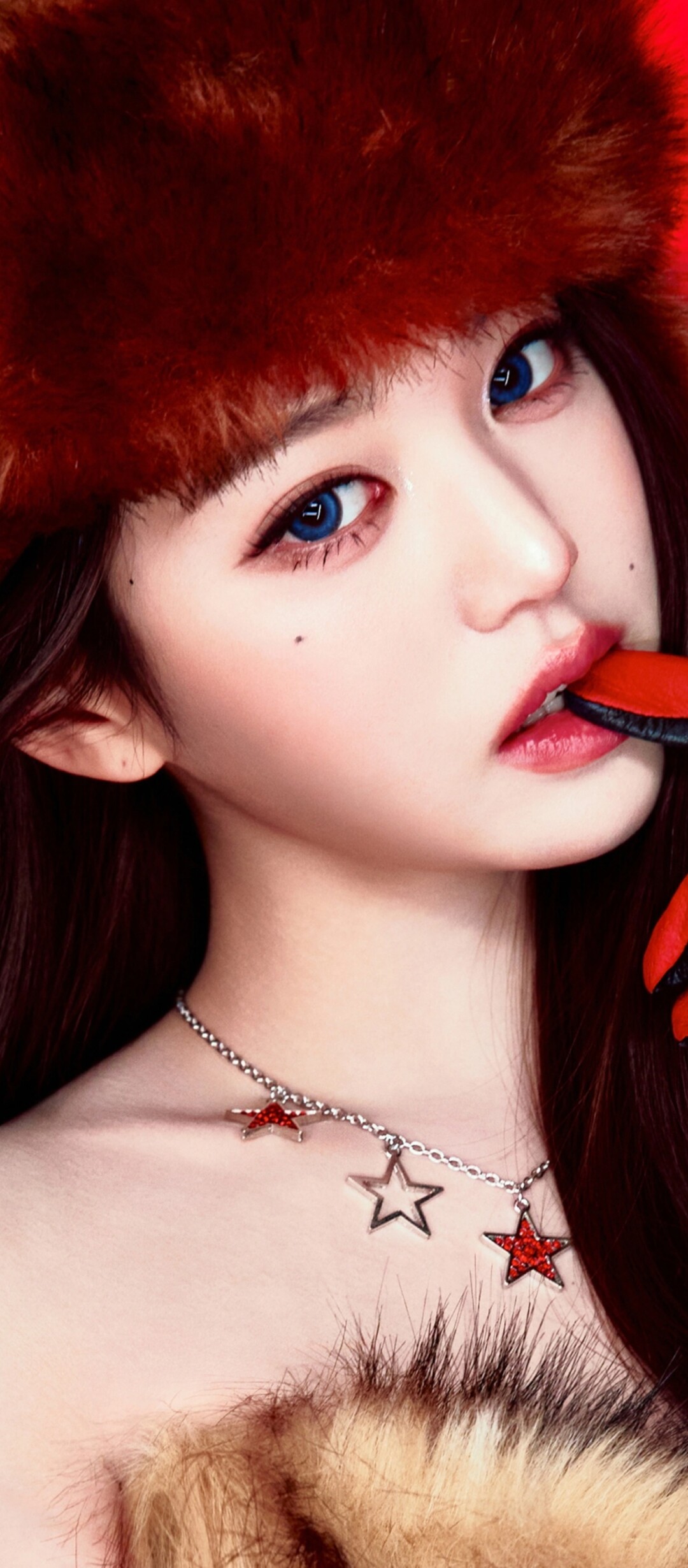 High-resolution portrait of K-pop idol Jang Wonyoung from IVE against a vivid red background