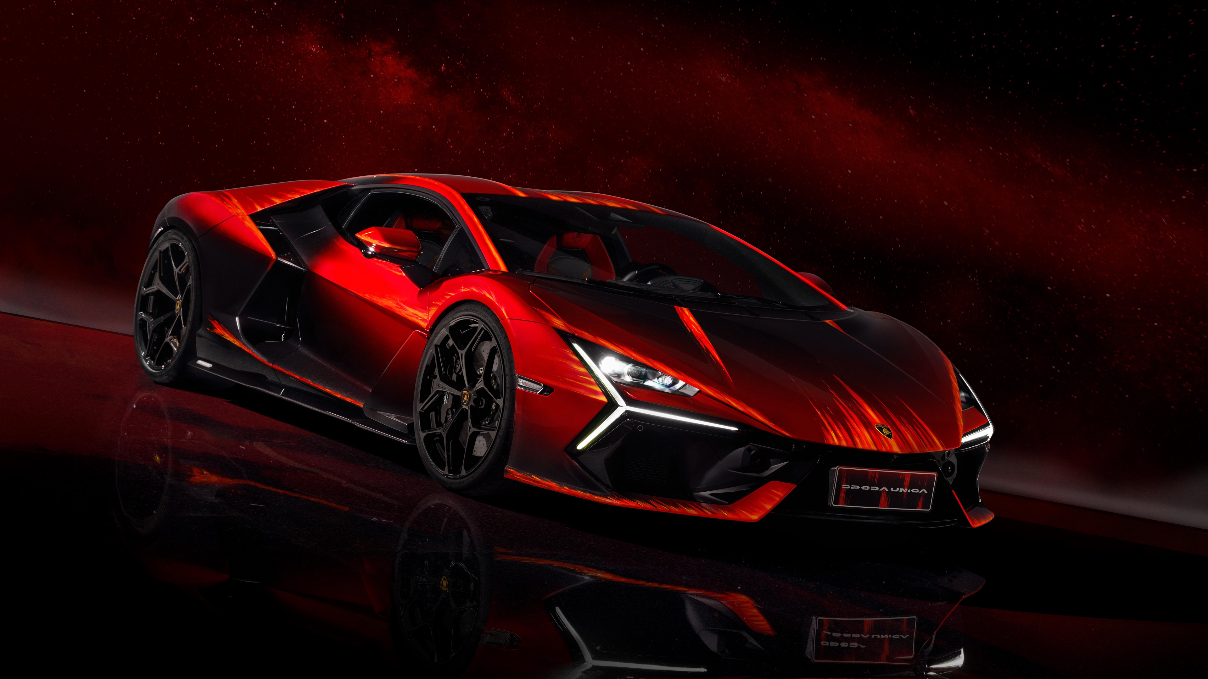 The Lamborghini Revuelto Opera Unica hypercar presented against a vibrant, solid red studio background.