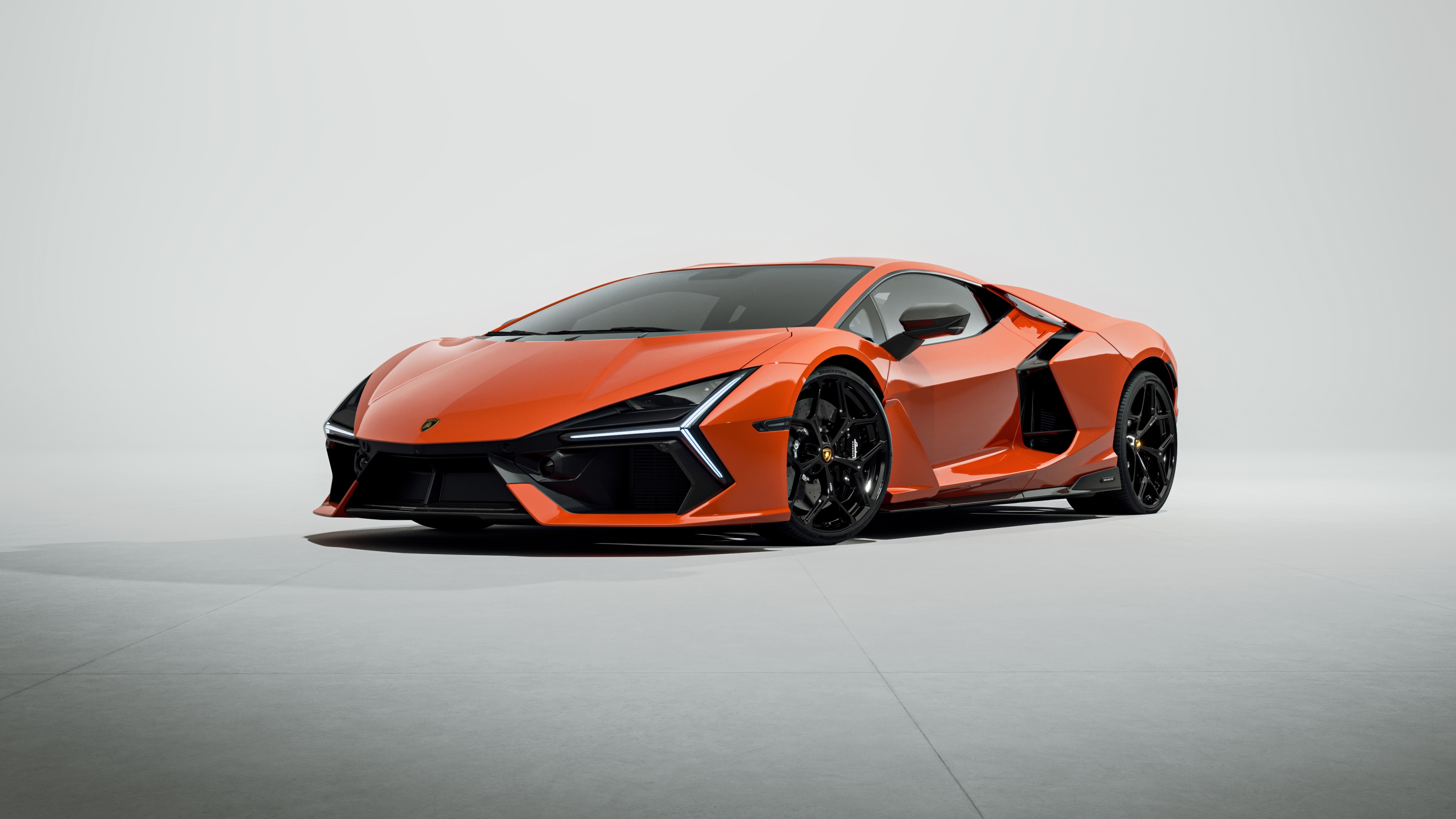 A high-detail studio shot of a Lamborghini Revuelto supercar on a plain white background.