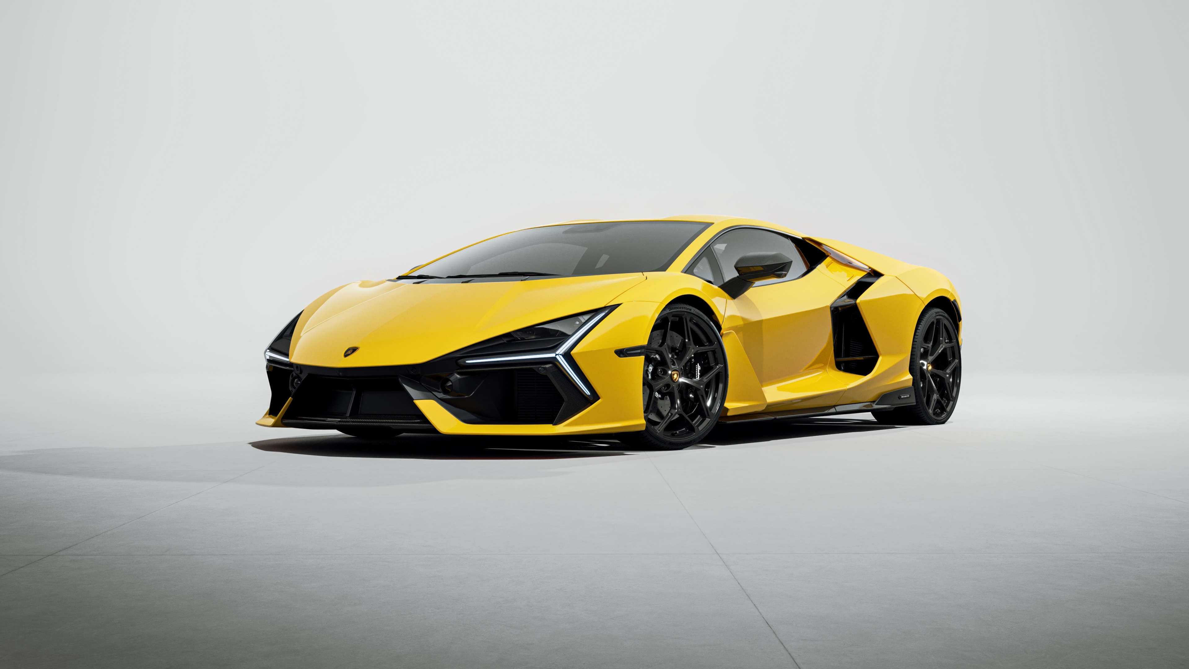 A high-resolution 5K image of the Lamborghini Revuelto super sports car isolated on a plain white background.