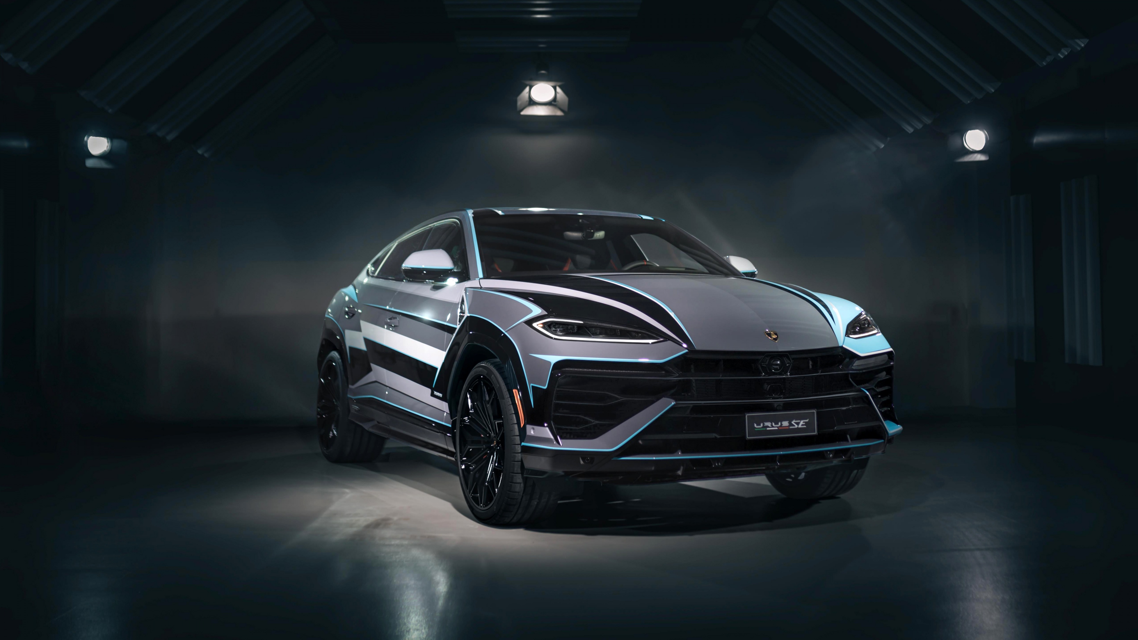 A luxurious Lamborghini Urus SE plug-in hybrid SUV featuring custom Ad Personam details in a dark, cinematic studio setting.